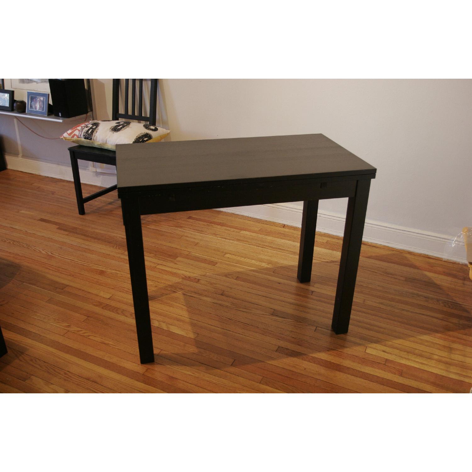 Ikea Brown/Black Bjursta Extendable Table - AptDeco