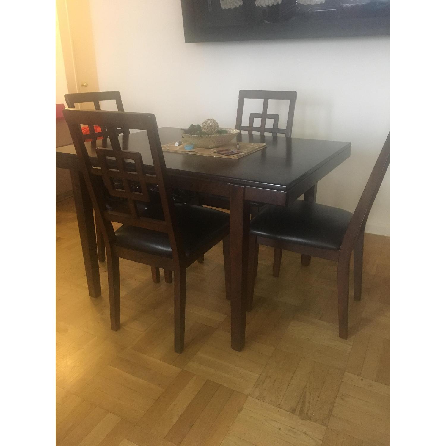 Jennifer Convertibles Cherry Wood Dining Table w/ 4 Chairs - AptDeco