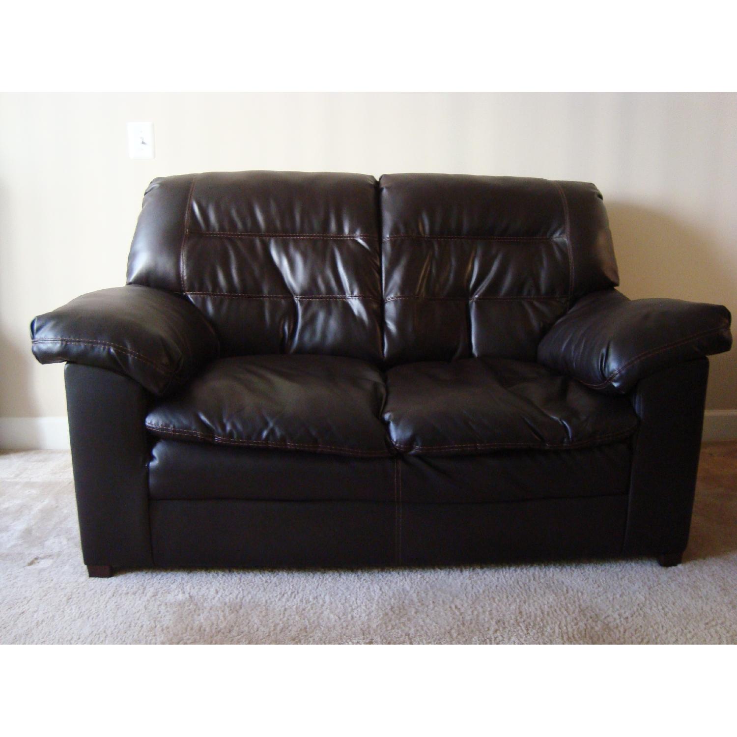 Ashley's Dark Brown Faux Leather Durablend Loveseat - image-1
