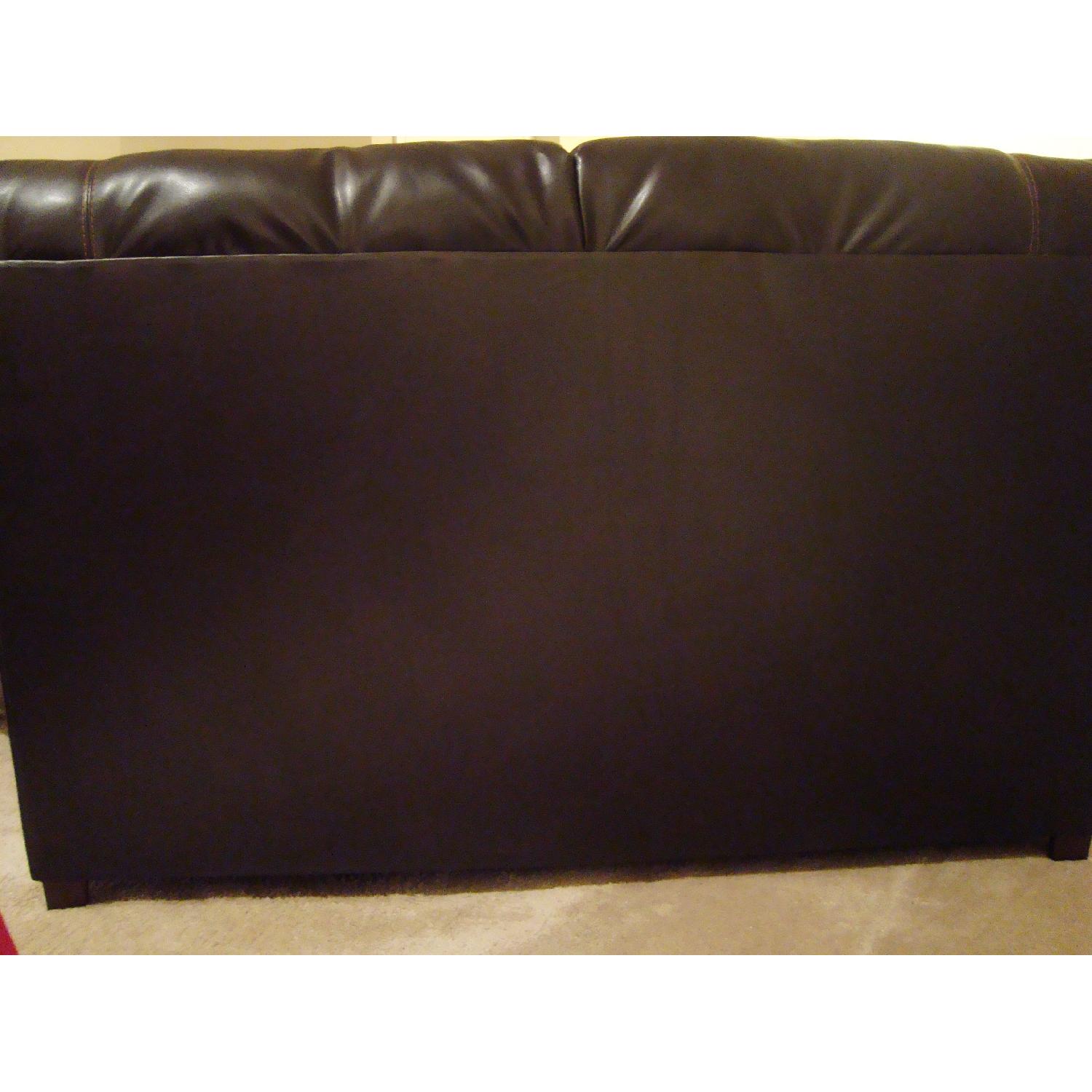 Ashley's Dark Brown Faux Leather Durablend Loveseat - image-4