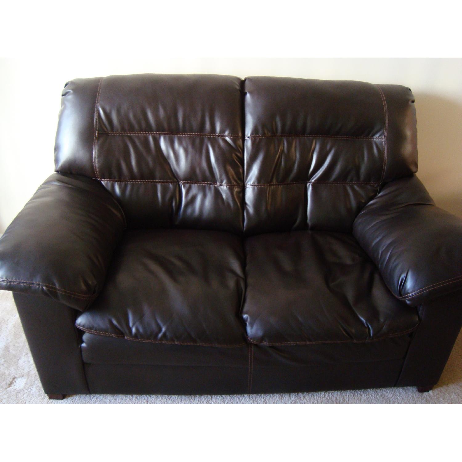 Ashley's Dark Brown Faux Leather Durablend Loveseat - image-6