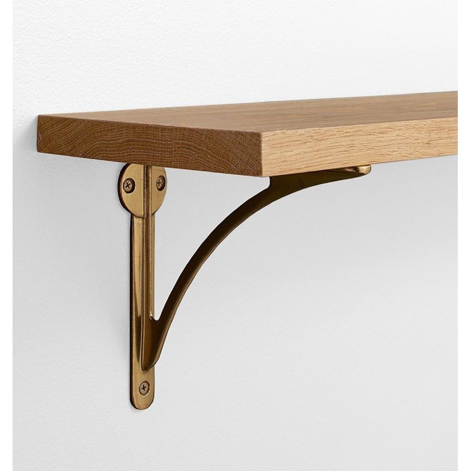 Rejuvenation Arched Shelf Bracket in Aged Brass - image-1