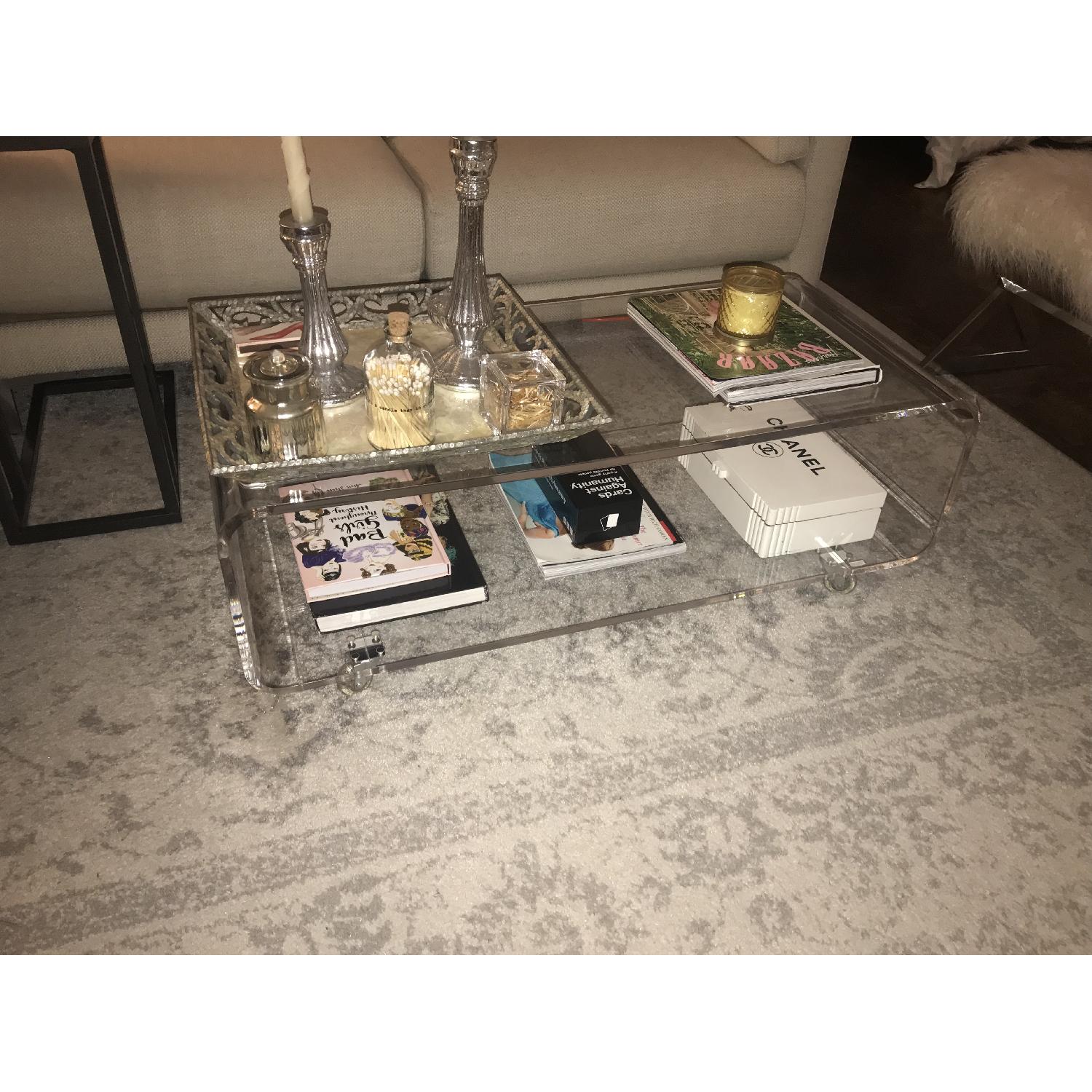 CB2 Peekaboo Acrylic Coffee Table on Wheels - AptDeco