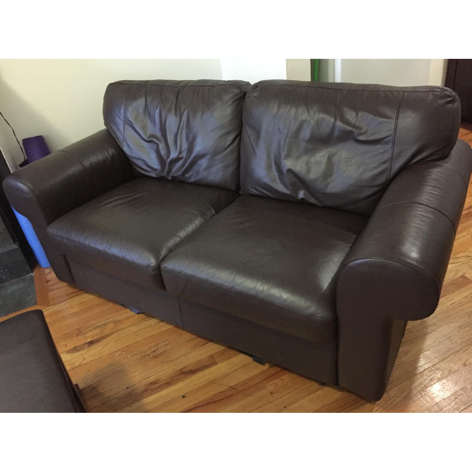 Ikea Dark Brown Faux Leather Couch & Ottoman - image-1