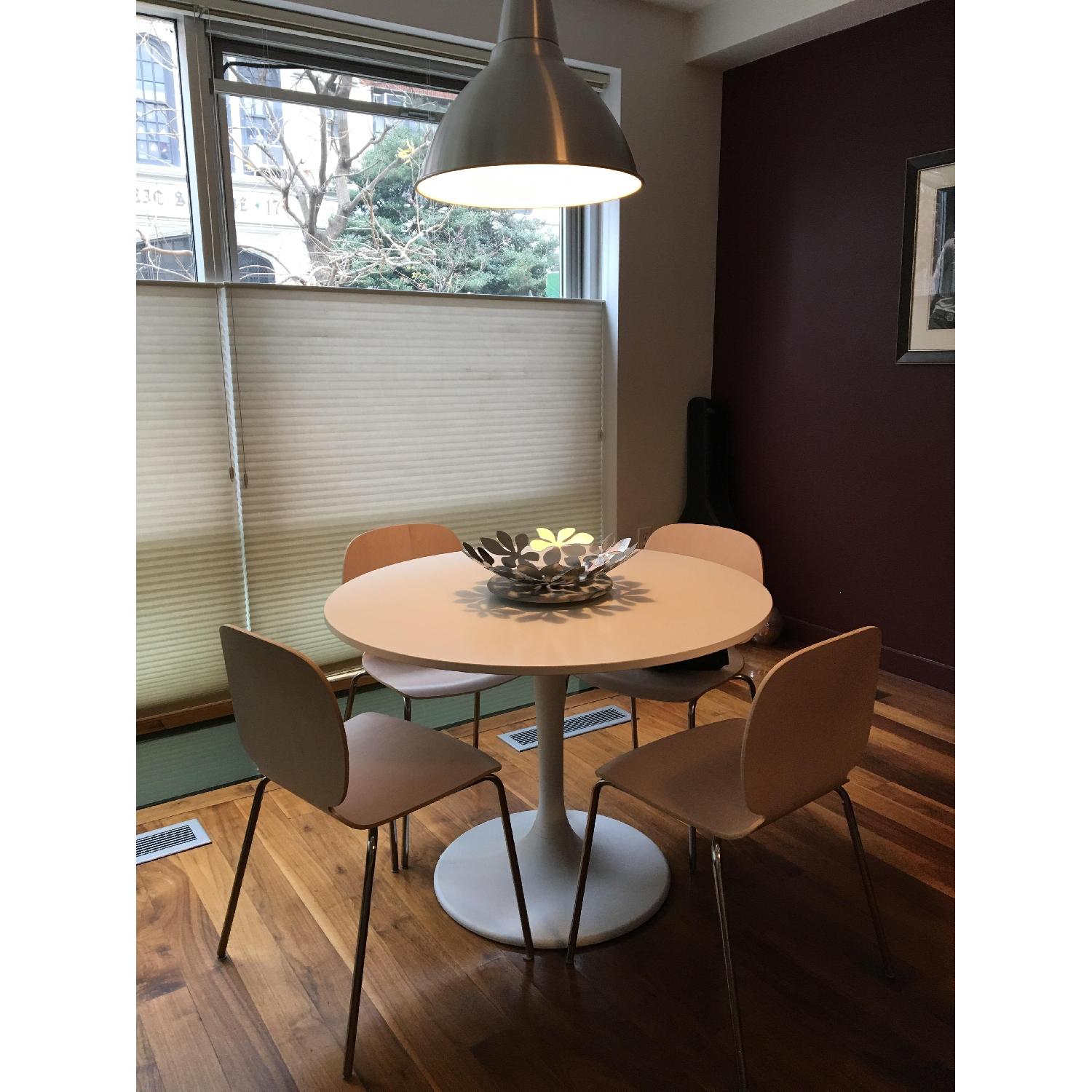 Ikea White Pedestal Table w/ 4 Natural Wood Chairs AptDeco