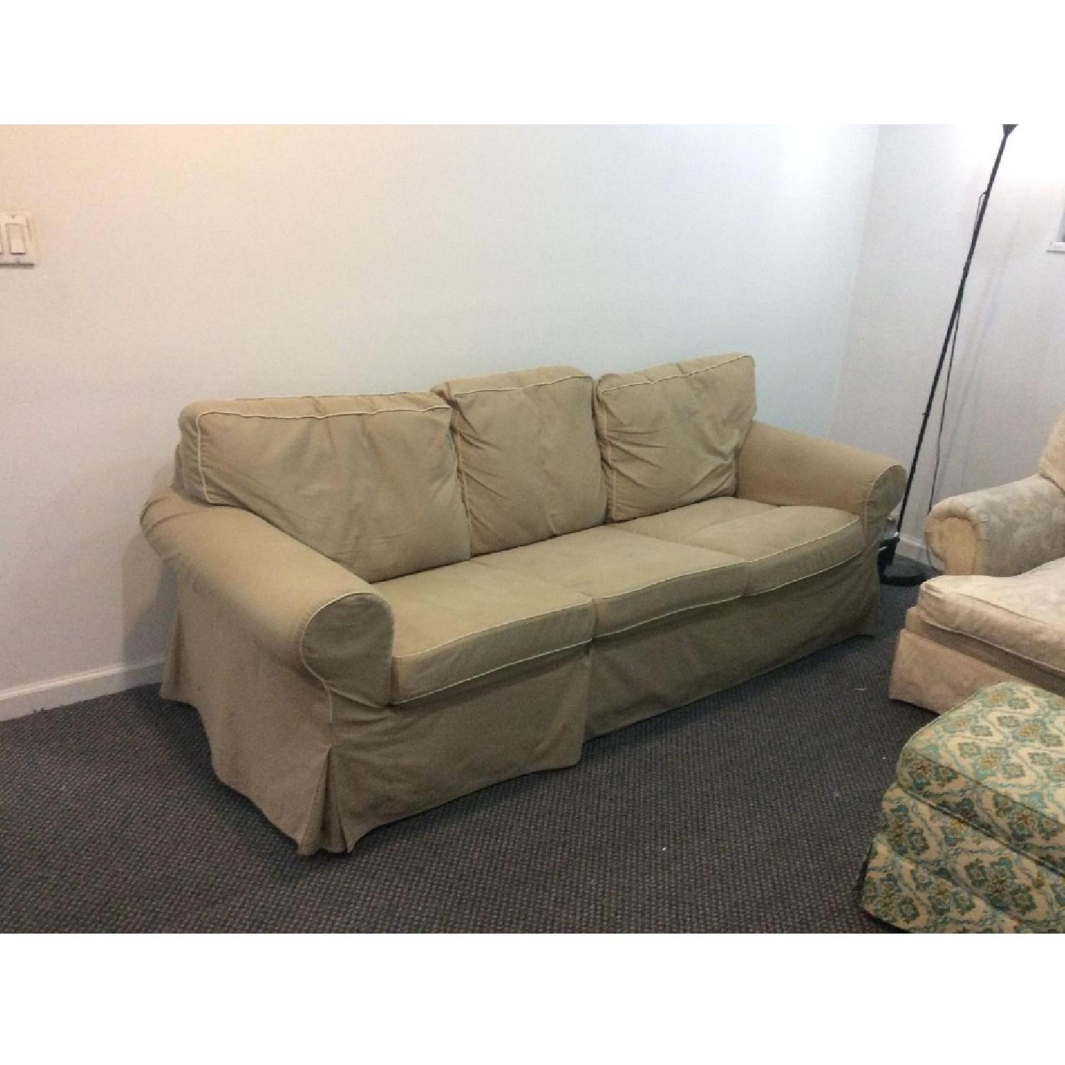 Beige Slipcovered Sofa - image-1