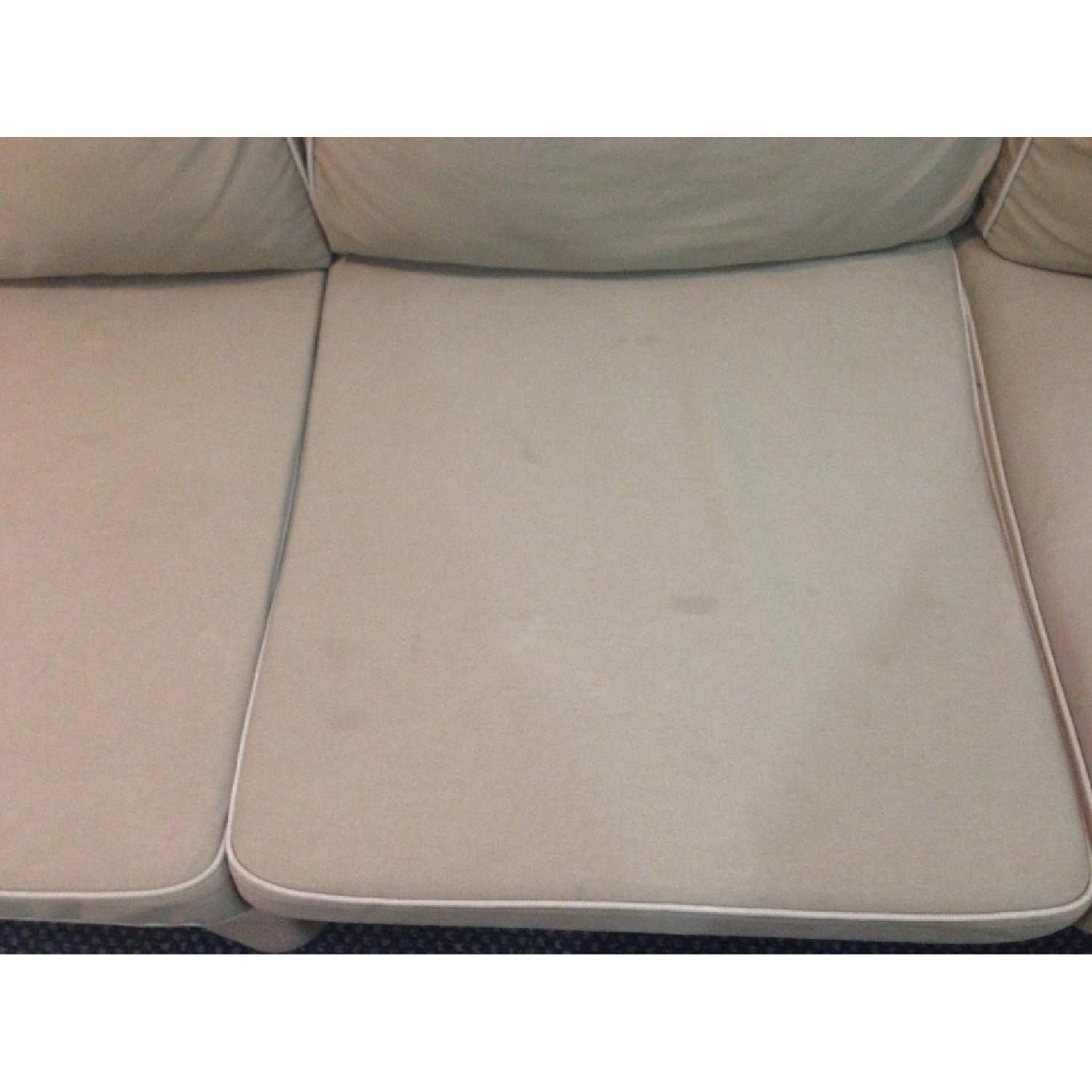 Beige Slipcovered Sofa - image-3