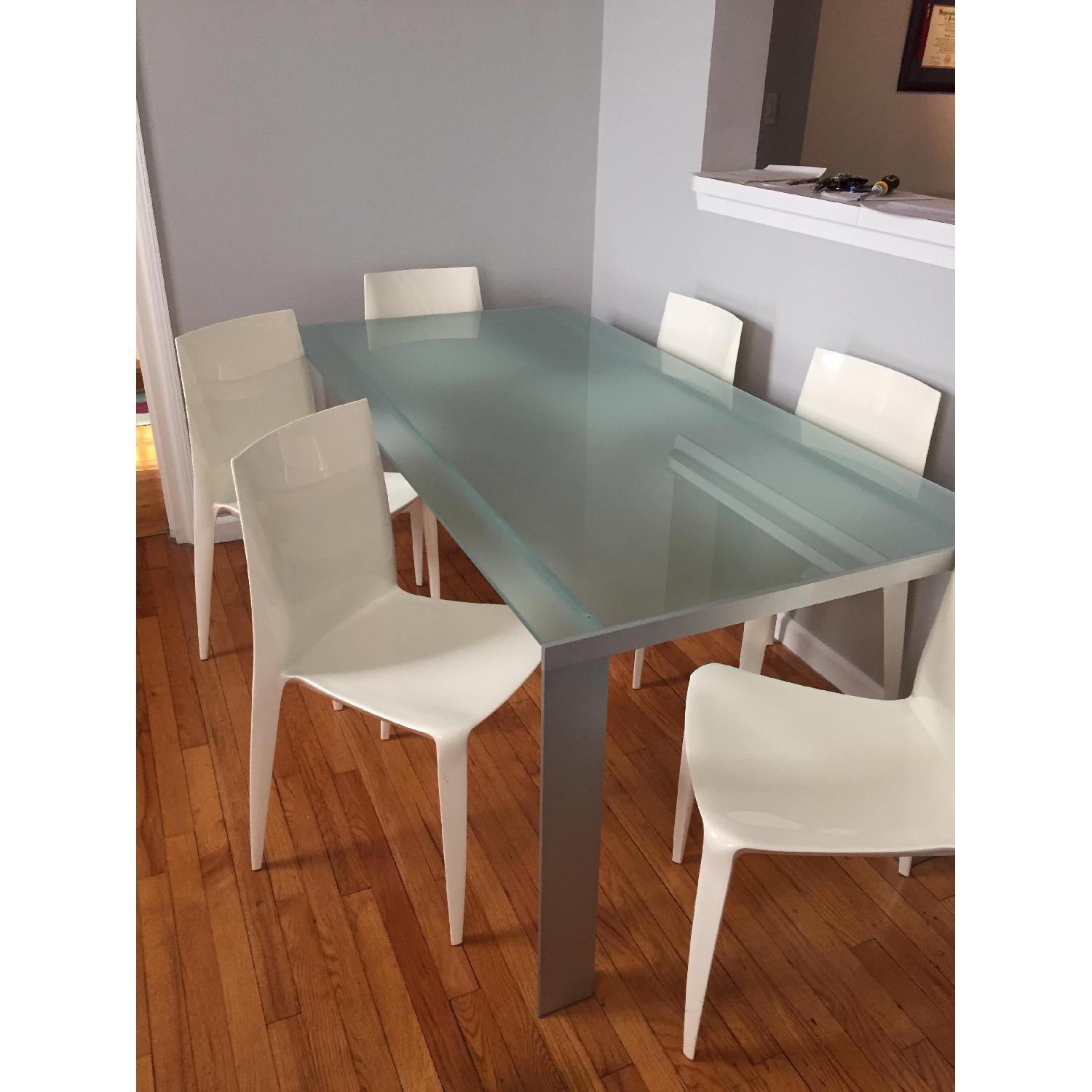 Glass Top Metal Frame Dining Table w/ 6 White Chairs AptDeco