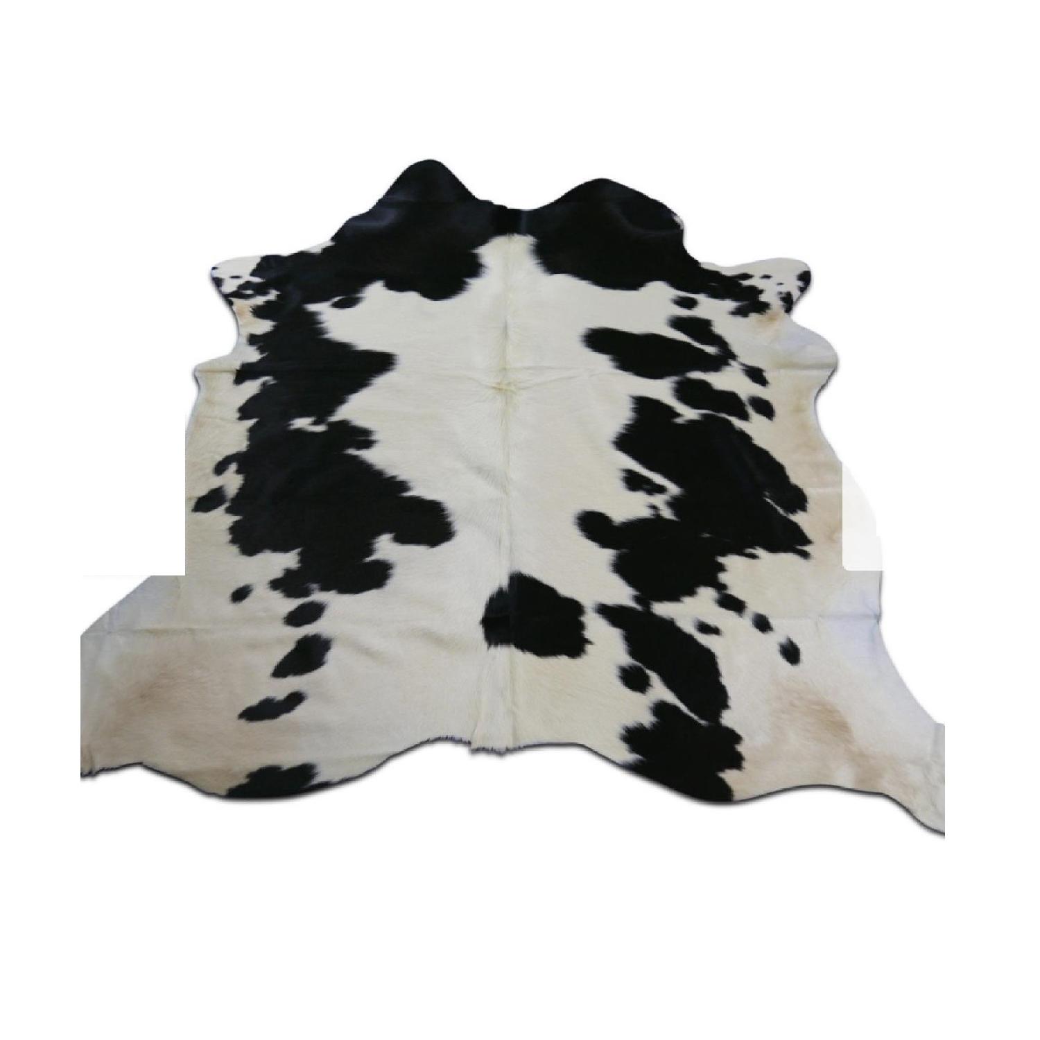 Holstein Black & Off White Spotted Cowhide Rug - AptDeco