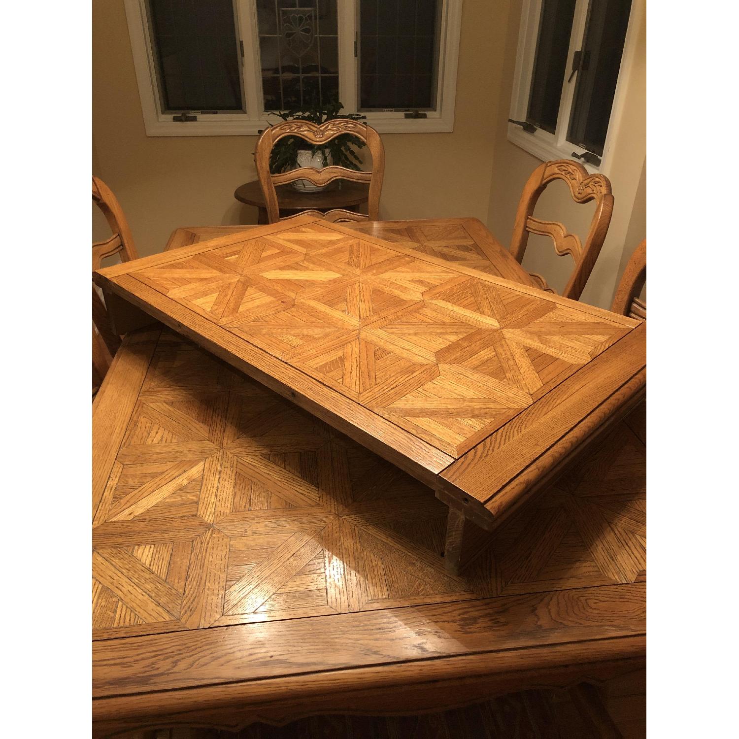 Provence Expandable Dining Table w/ 8 Chairs - AptDeco