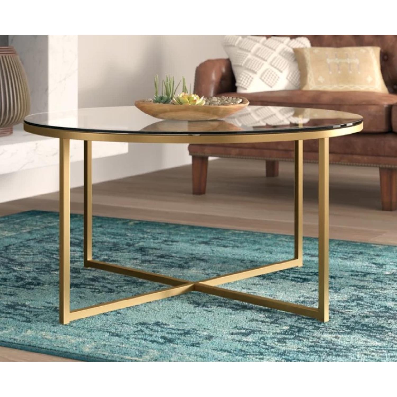 Mercer41 Round Glass Coffee Table w/ Gold Trim AptDeco