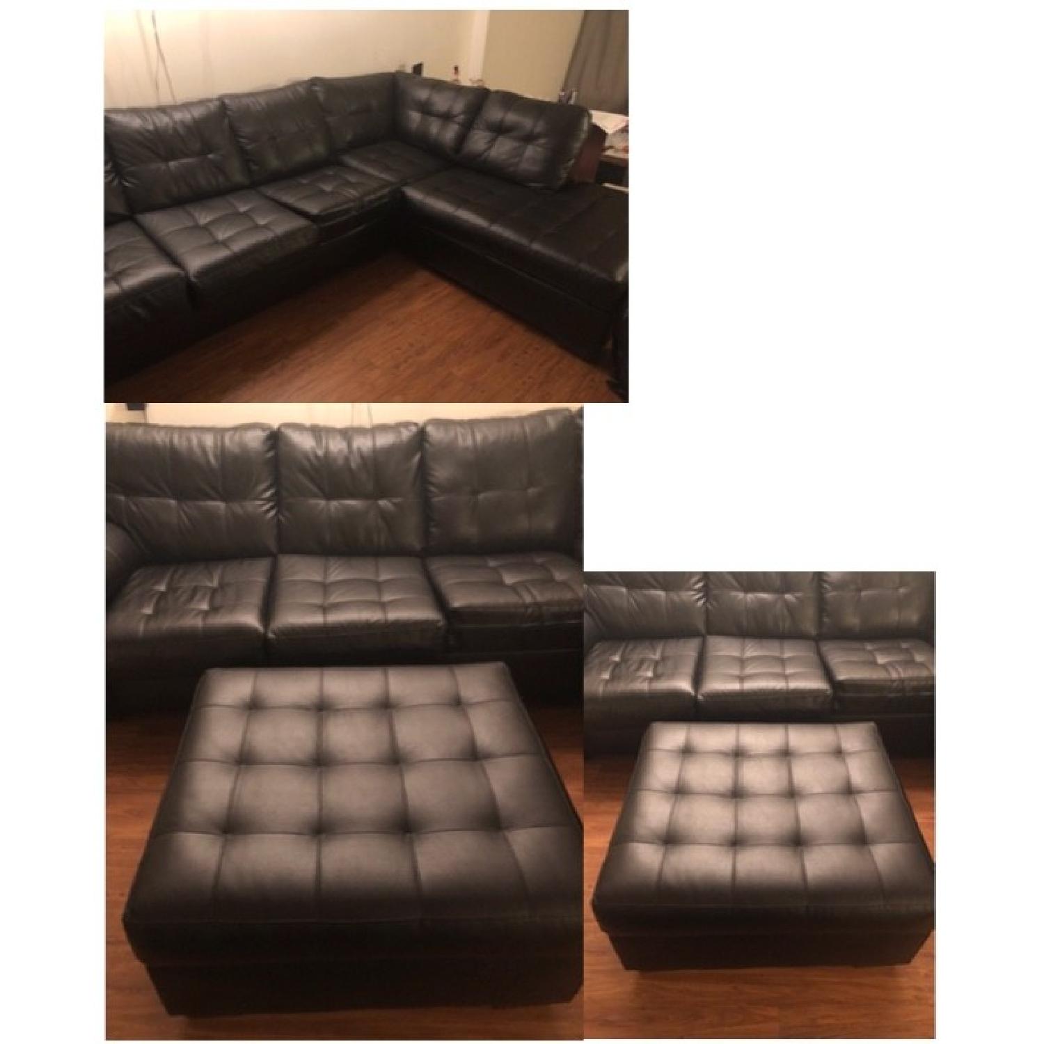 Bob's Black Faux Leather Sleeper Sectional Sofa AptDeco