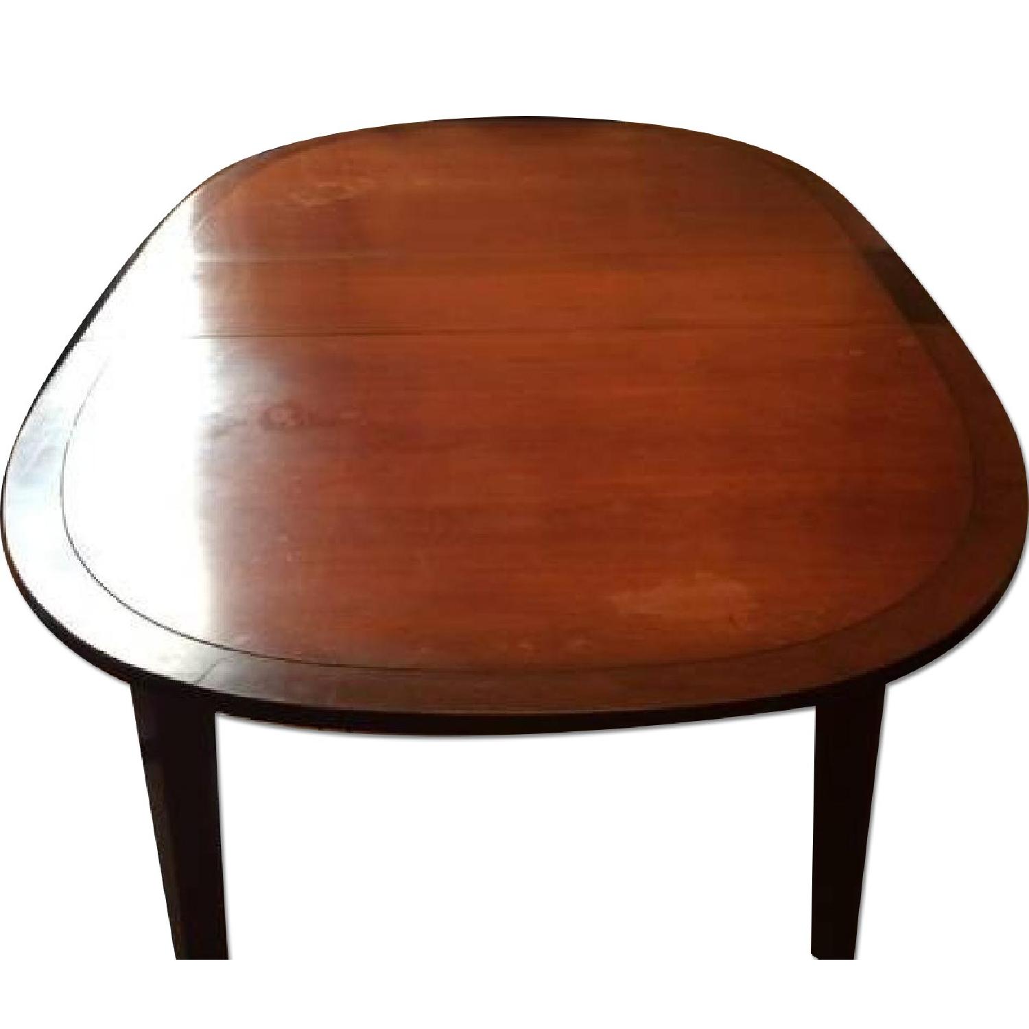 Solid Wood Extendable Dining Table - AptDeco