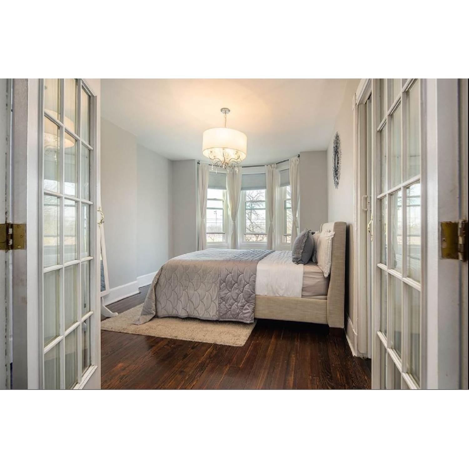 Ashley Light Beige Upholstered Queen Bed - image-1