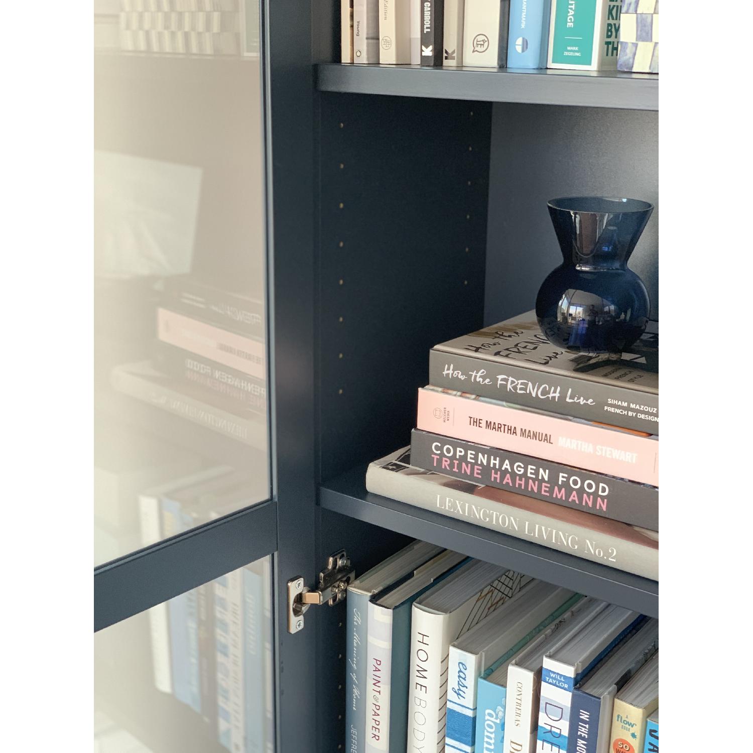 Ikea Billy Navy Blue Bookcase w/ Glass Doors AptDeco