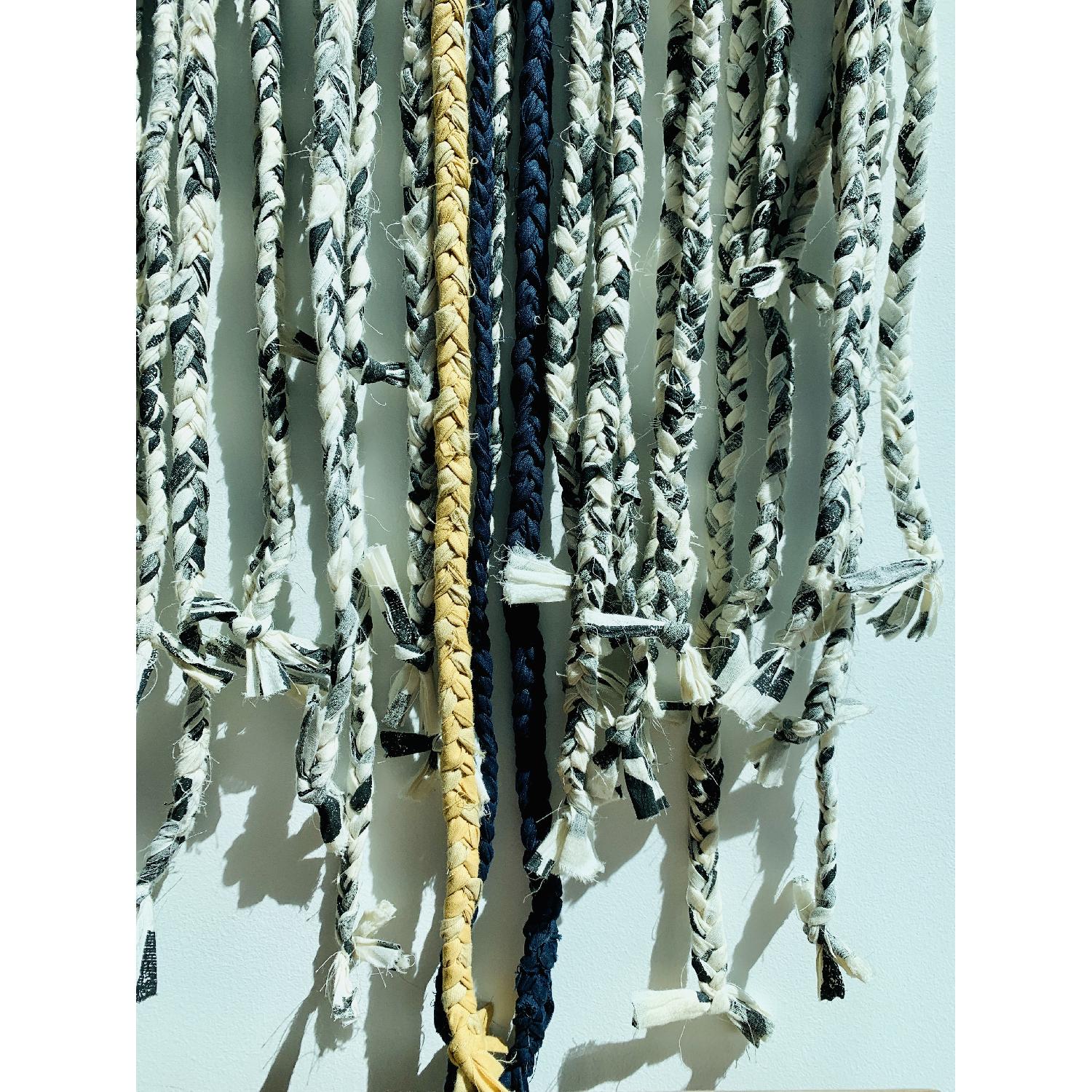 CB2 Braided Fringe Wall Hanging AptDeco