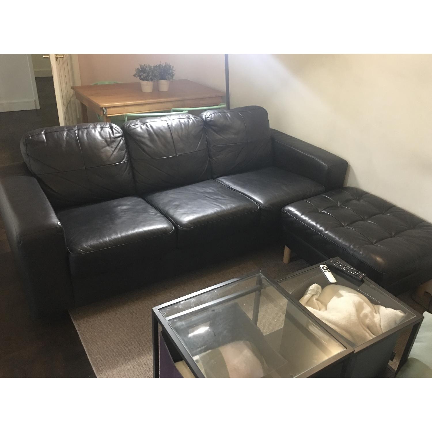 Ikea Black Leather 3Seater Sofa & Ottiman AptDeco