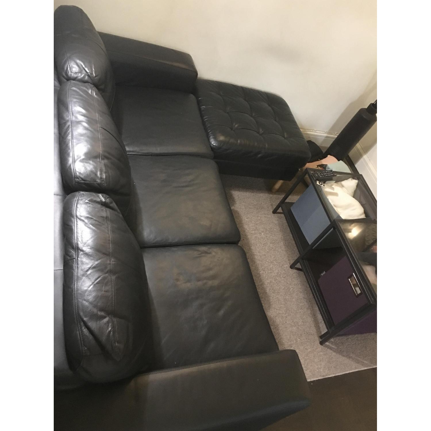 Ikea Black Leather 3Seater Sofa & Ottiman AptDeco
