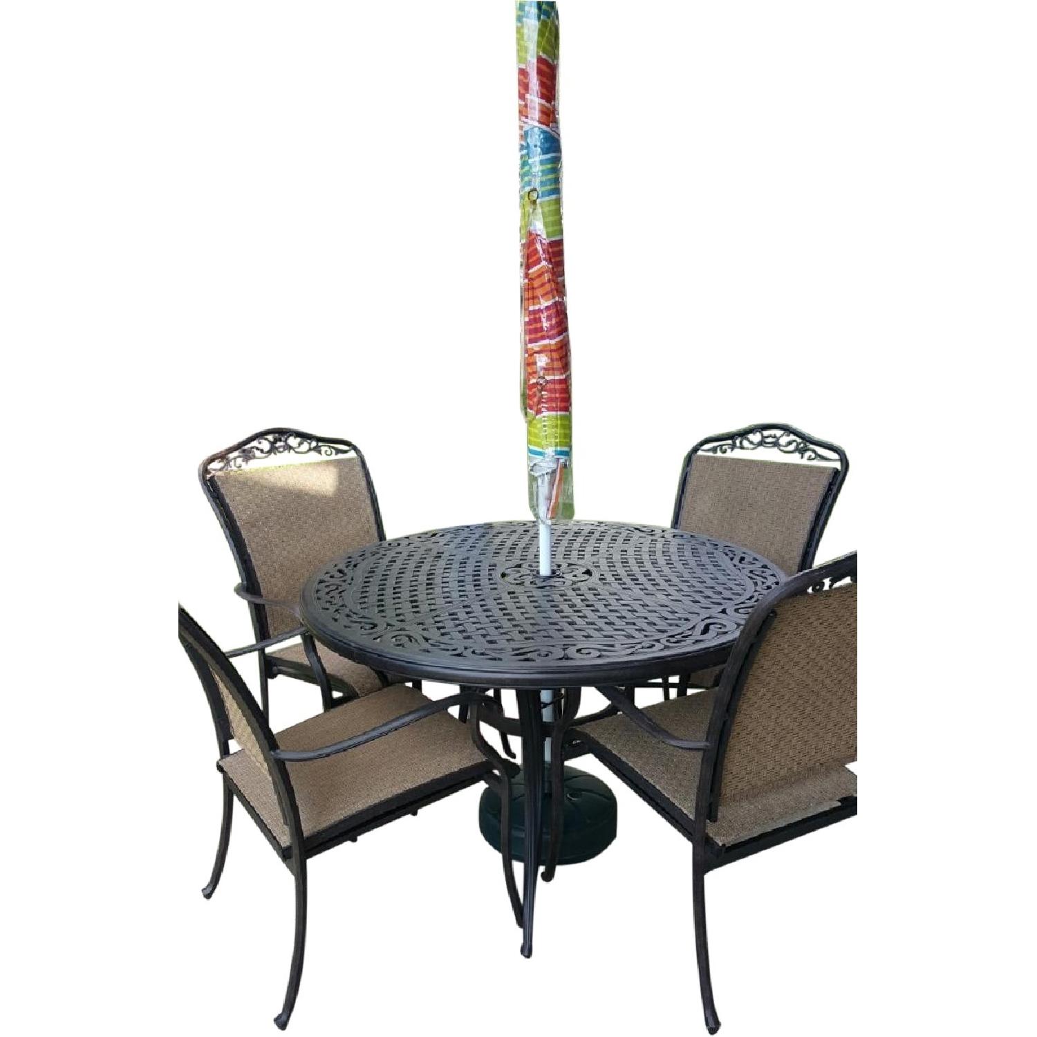 Beachmont Patio Round Table w/ 4 Chairs + Umbrella & Stand AptDeco