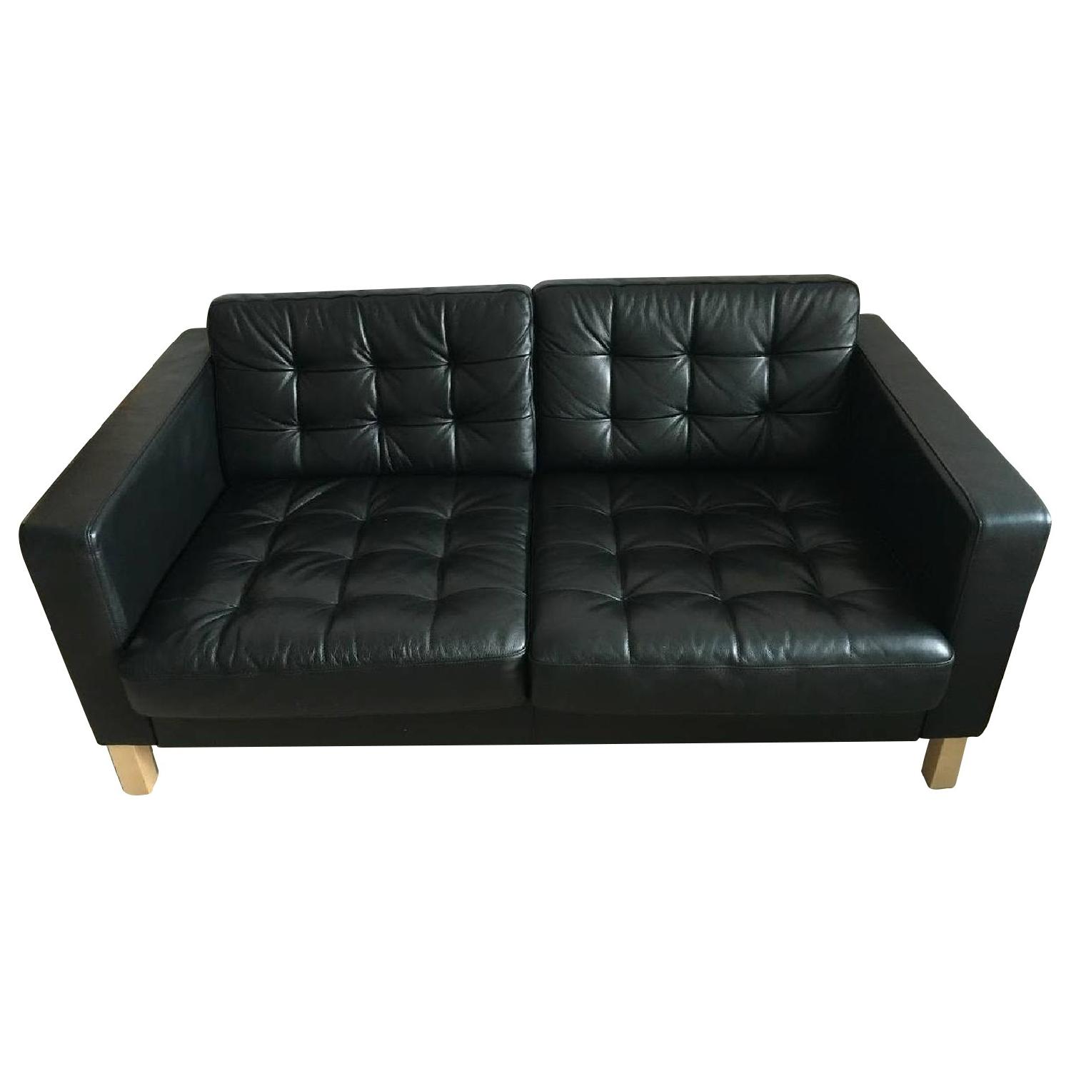 Ikea Karlstad Black Leather Loveseat - AptDeco