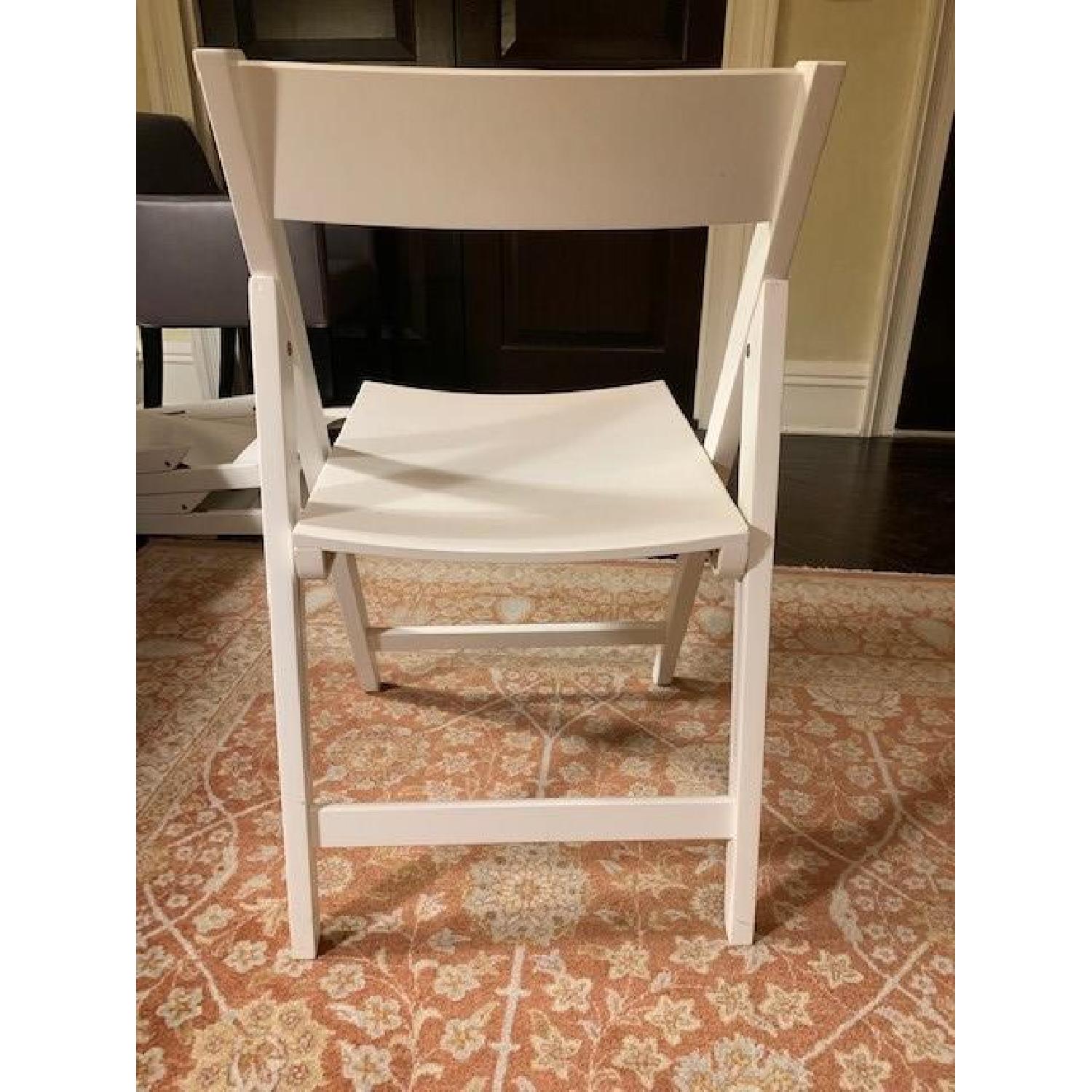Crate & Barrel White Folding Chairs AptDeco