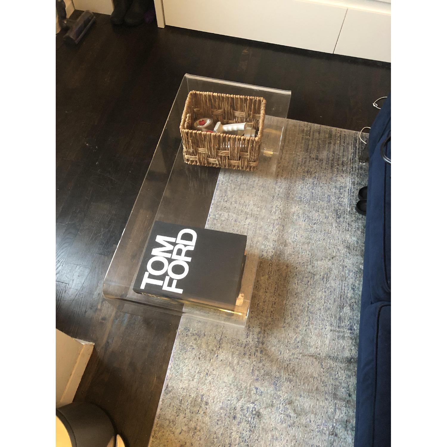 CB2 Acrylic Rolling Coffee Table AptDeco