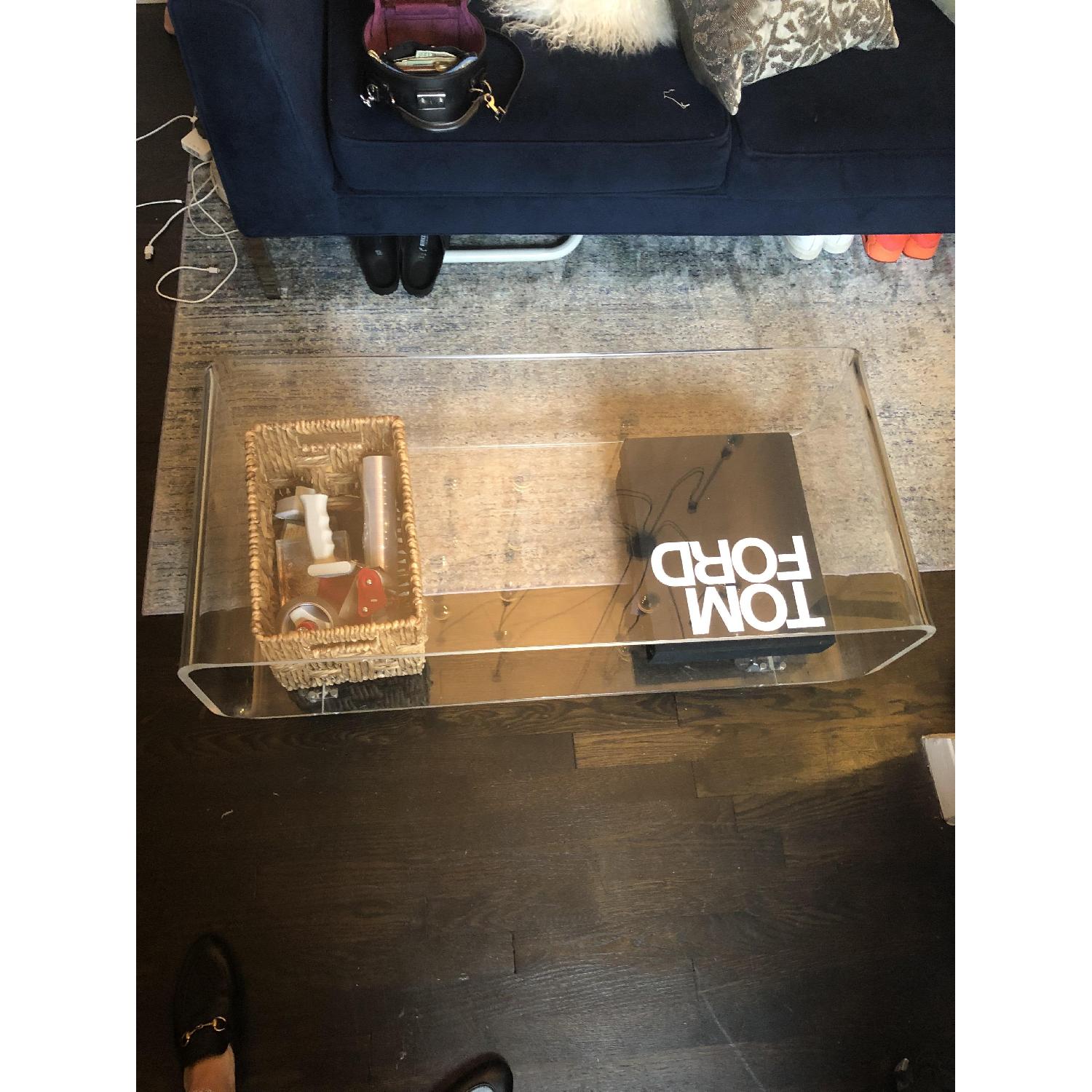 CB2 Acrylic Rolling Coffee Table AptDeco