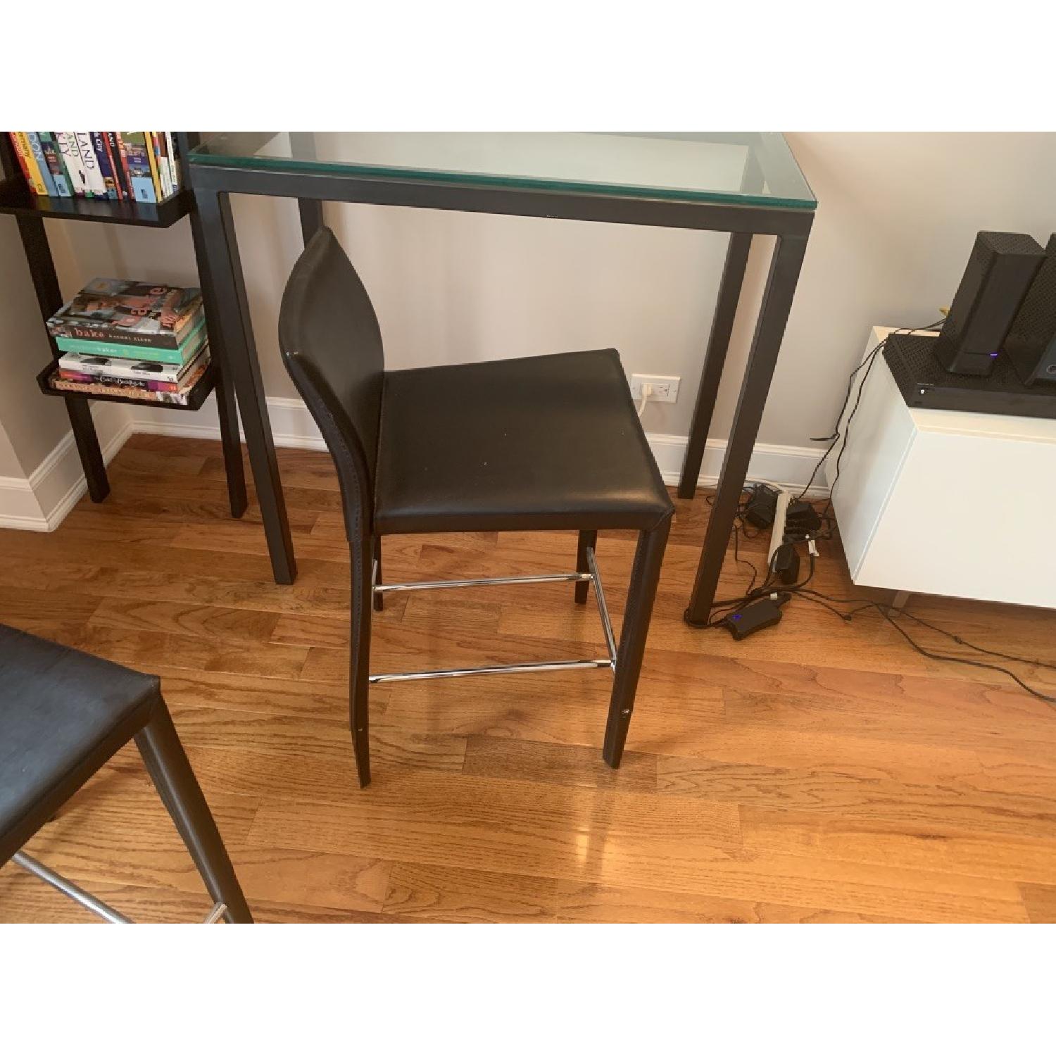 West Elm Glass Top Counter Table w/ 2 Black Bar Stools AptDeco