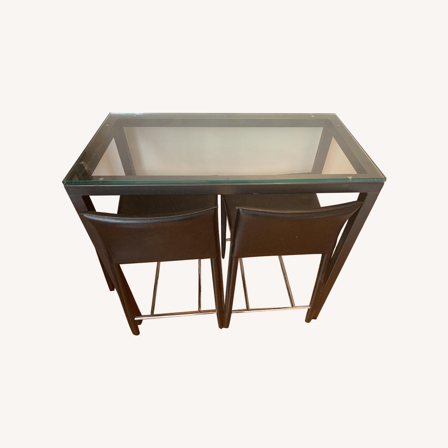 West Elm Glass Top Counter Table w/ 2 Black Bar Stools AptDeco