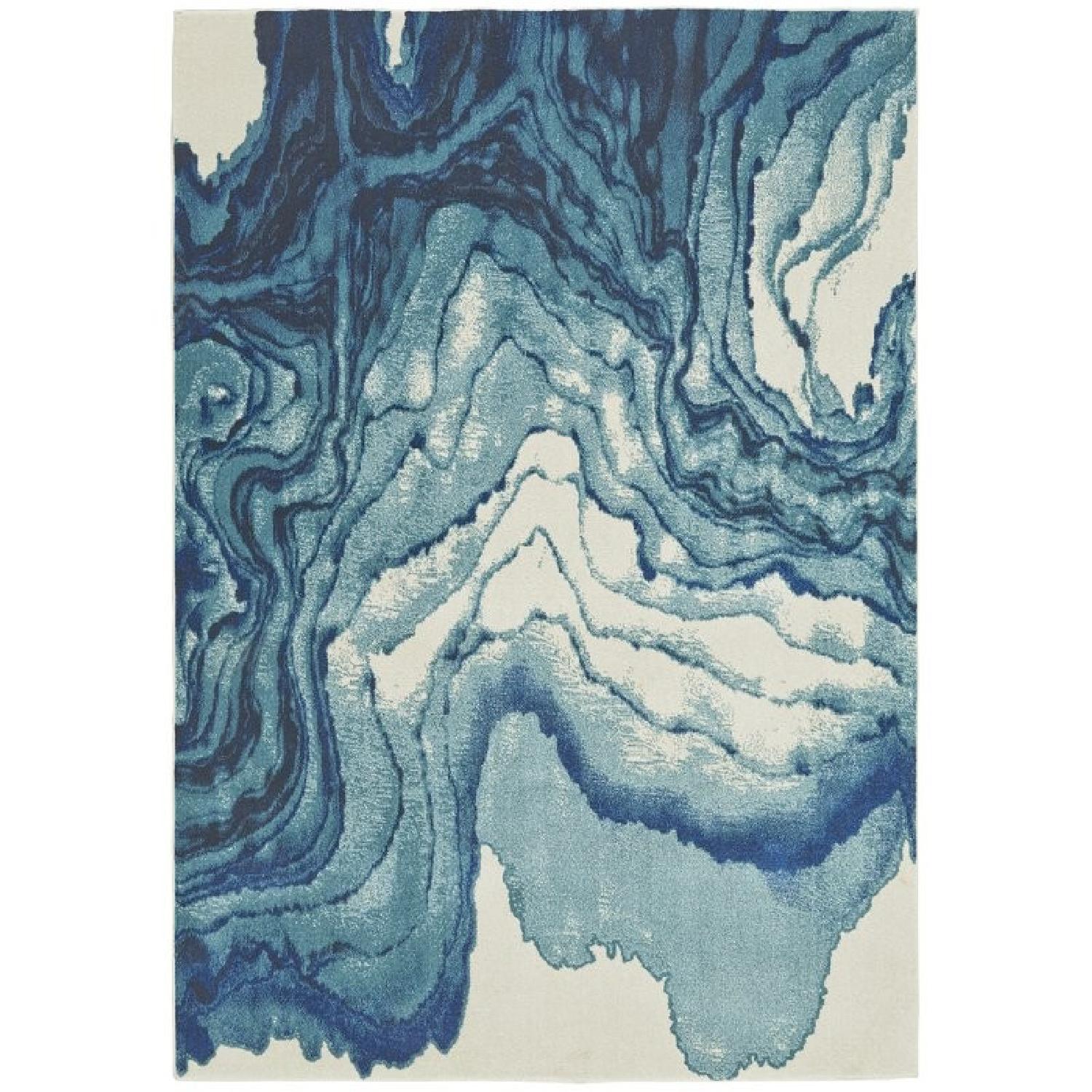 Zipcode Design Peoples Blue Area Rug - AptDeco