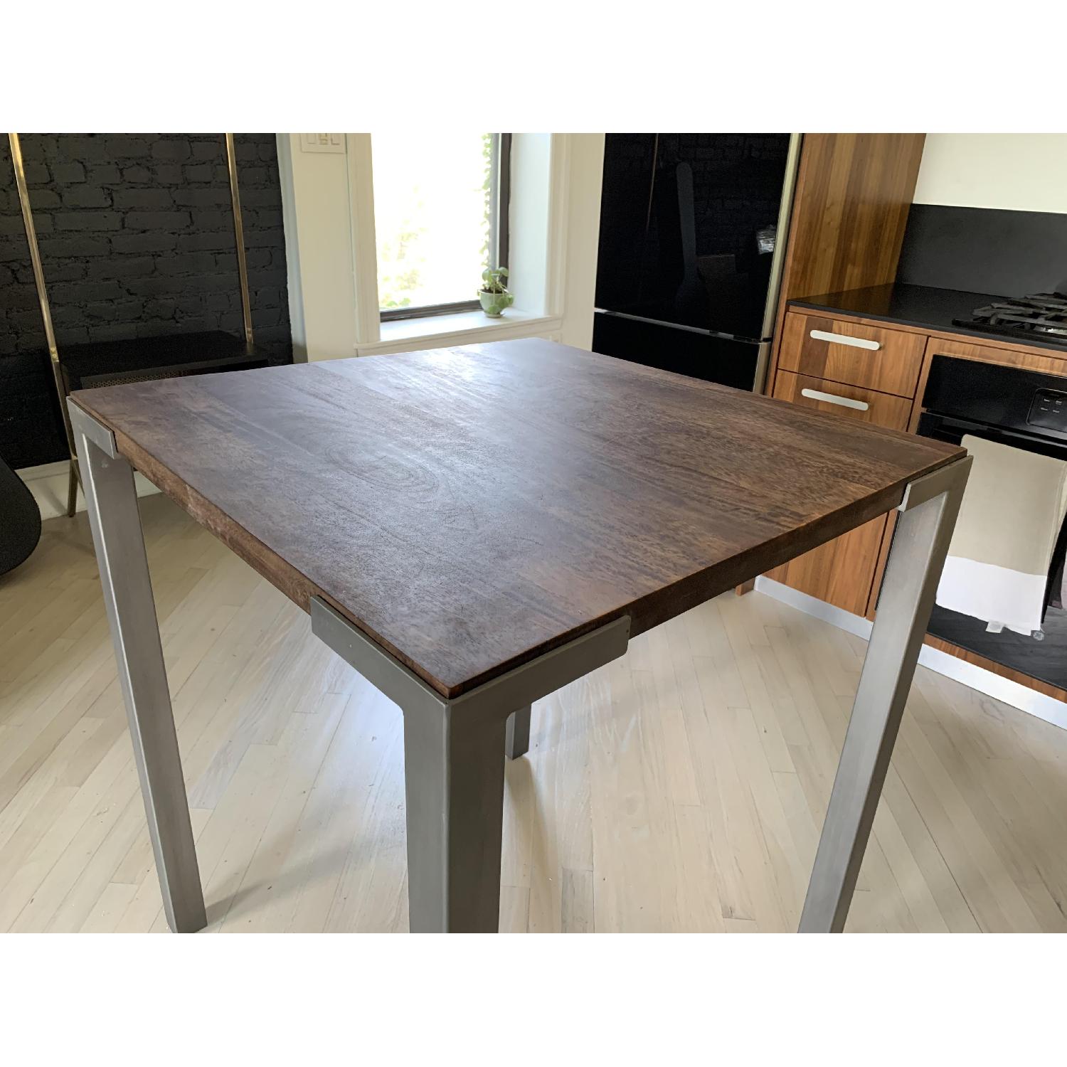 CB2 Stilt Square High Dining Table AptDeco