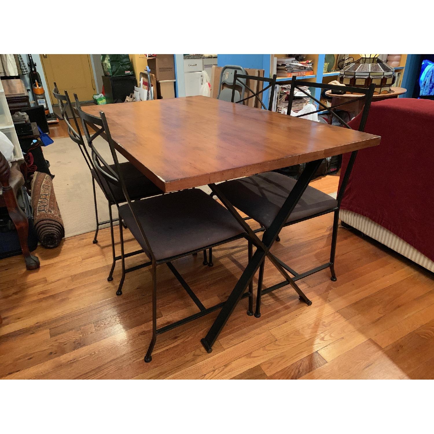 Solid Wood Dining Table w/ 4 Wrought-Iron Chairs - AptDeco