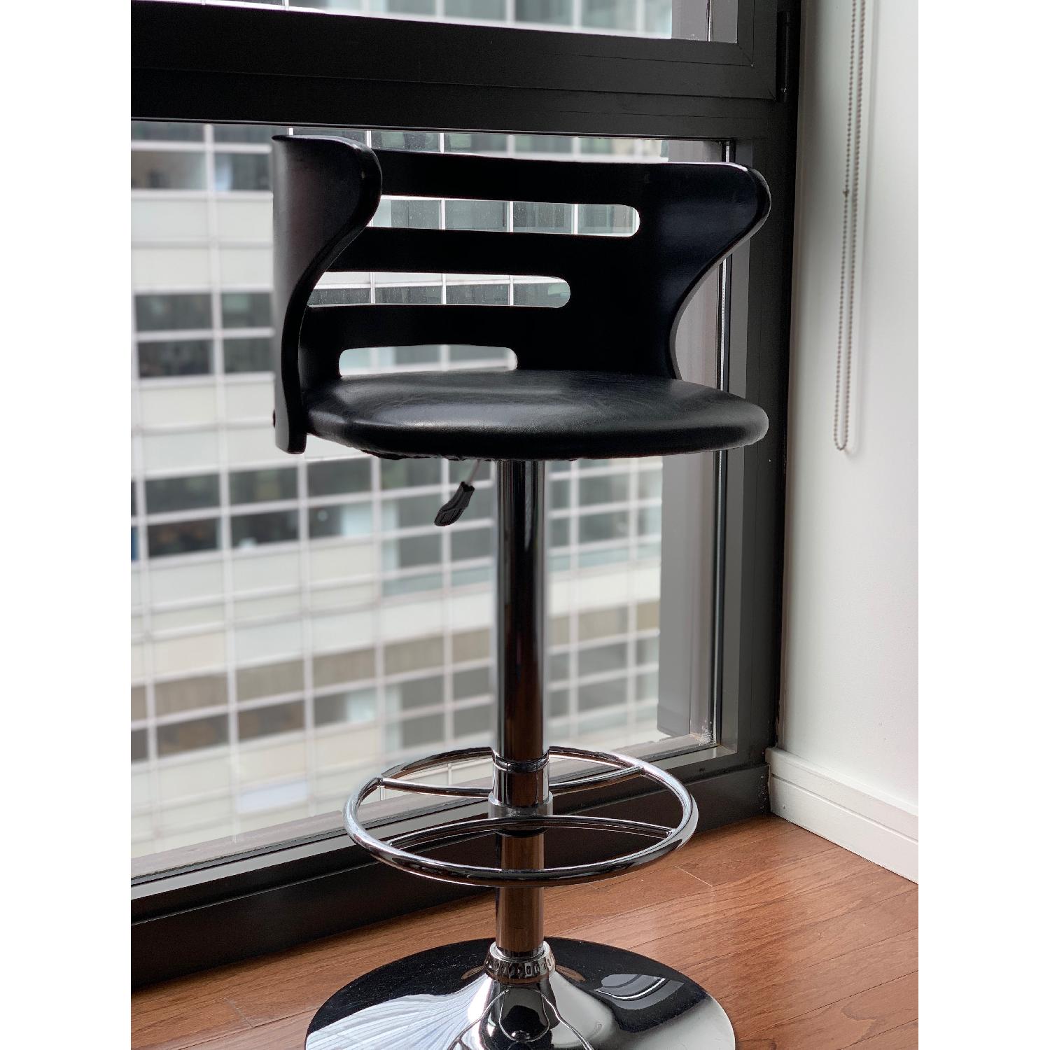 CB2 Black Faux Leather Bar Stools AptDeco