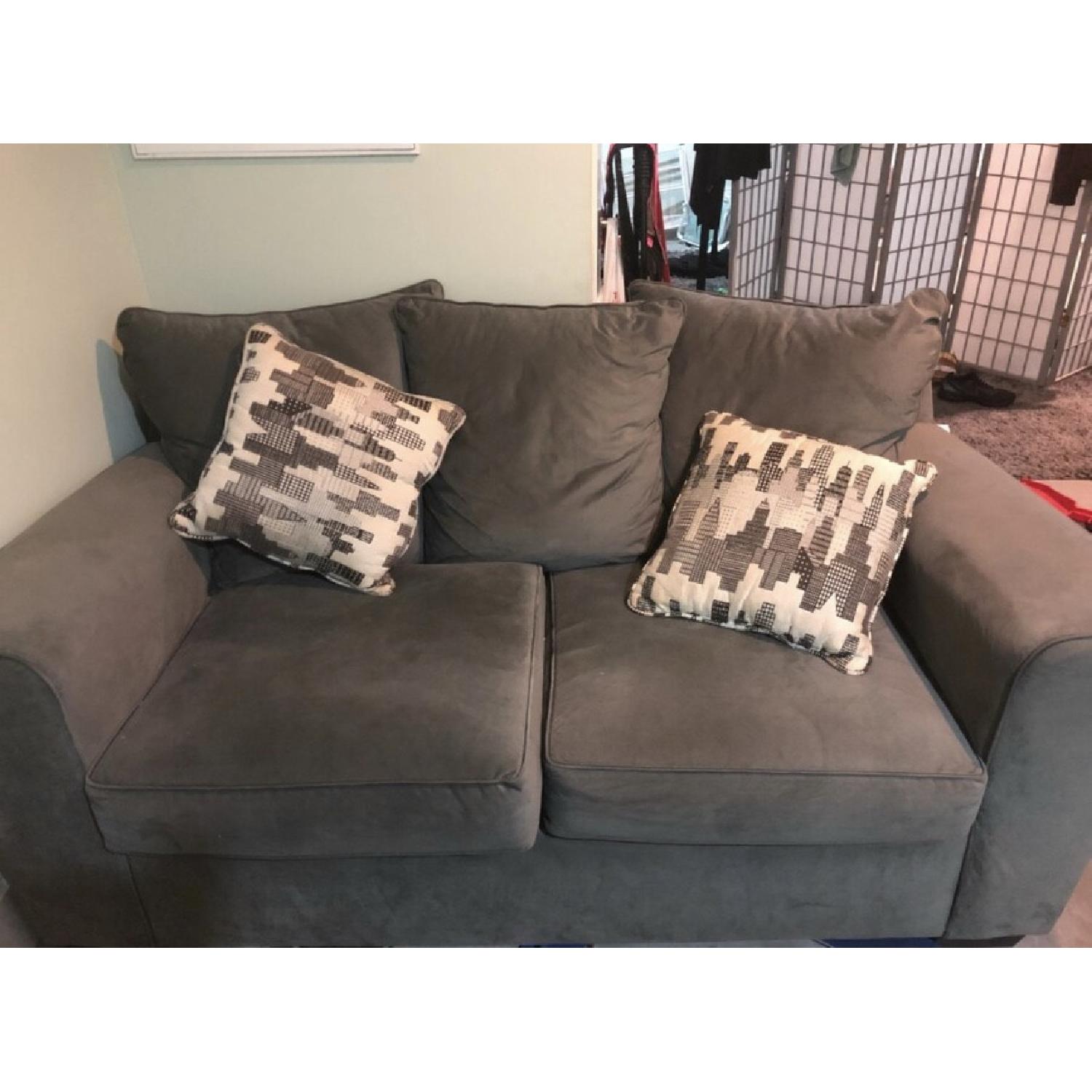 Grey loveseats and ottoman - image-1