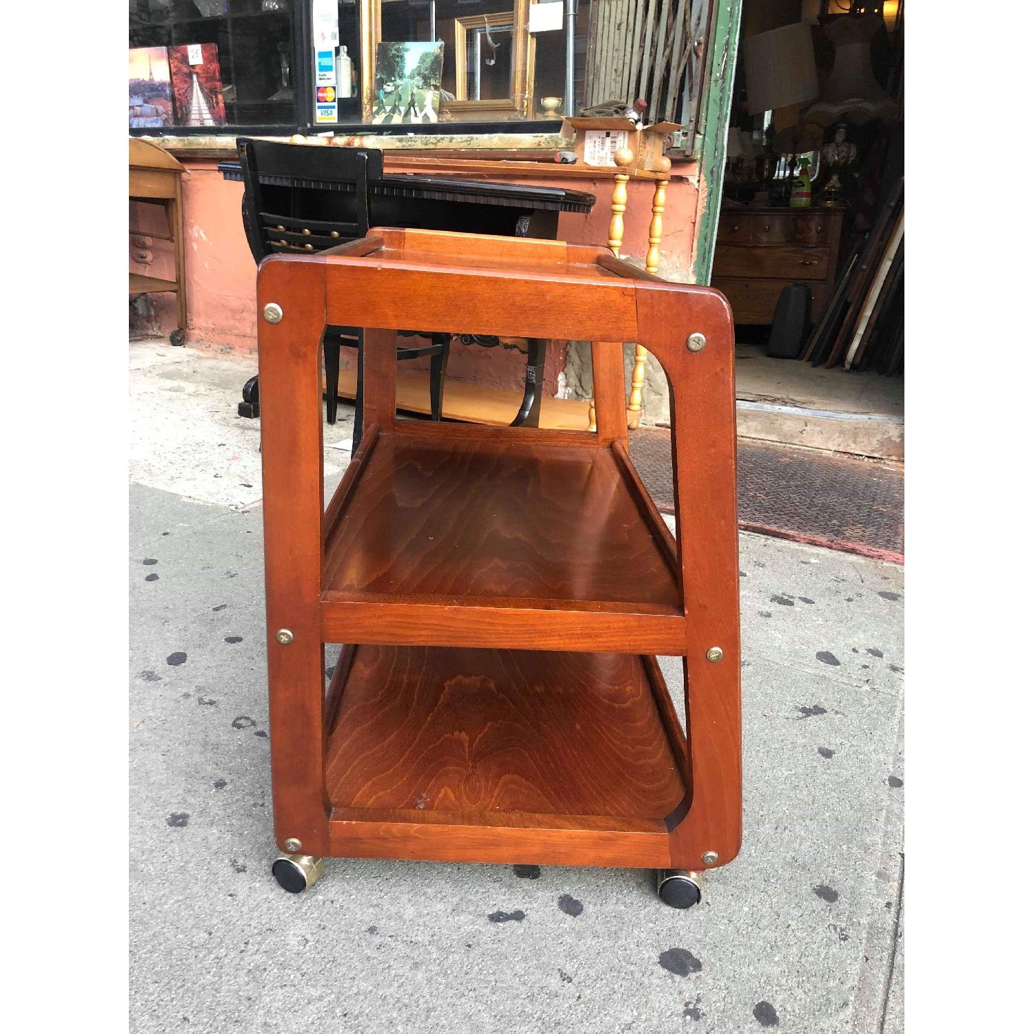 Vintage TV Stand on Wheels AptDeco