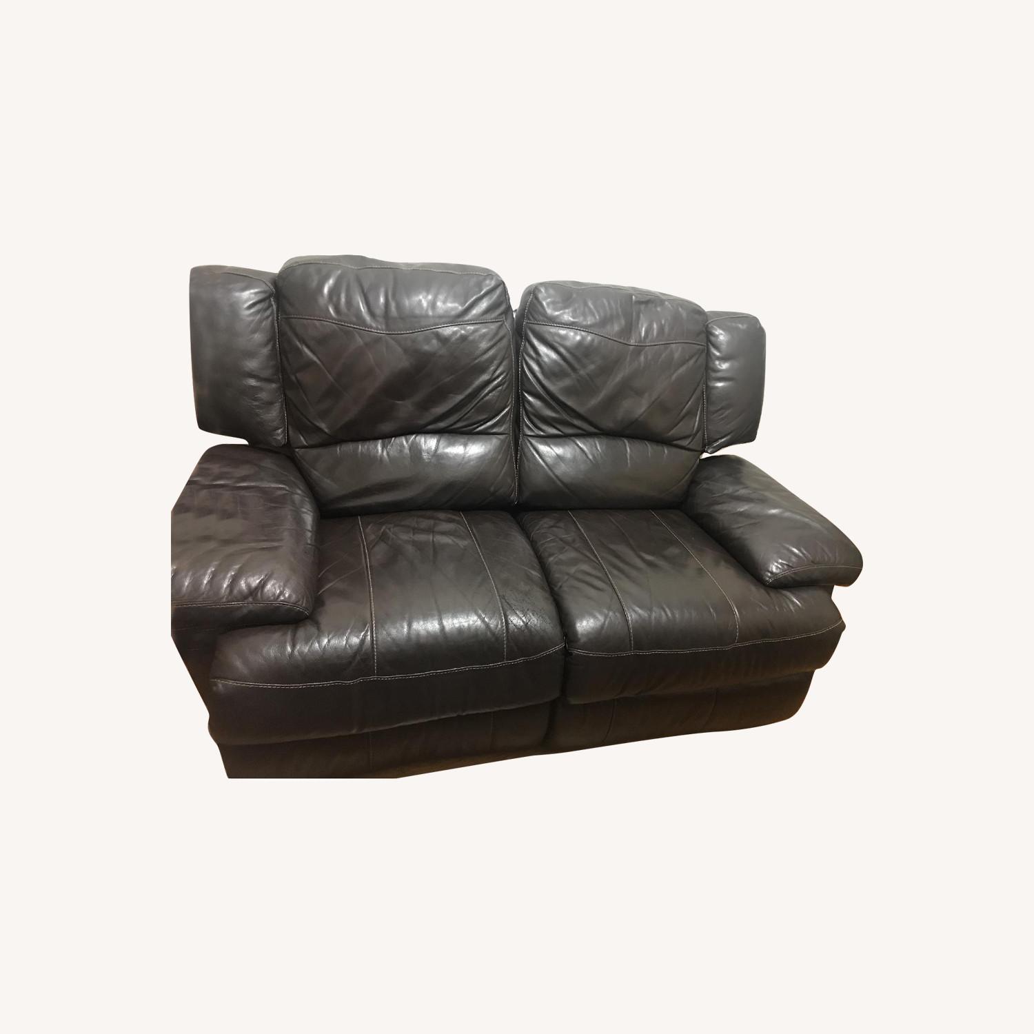 Jordan's Dark Brown Leather Reclining Loveseat - image-0