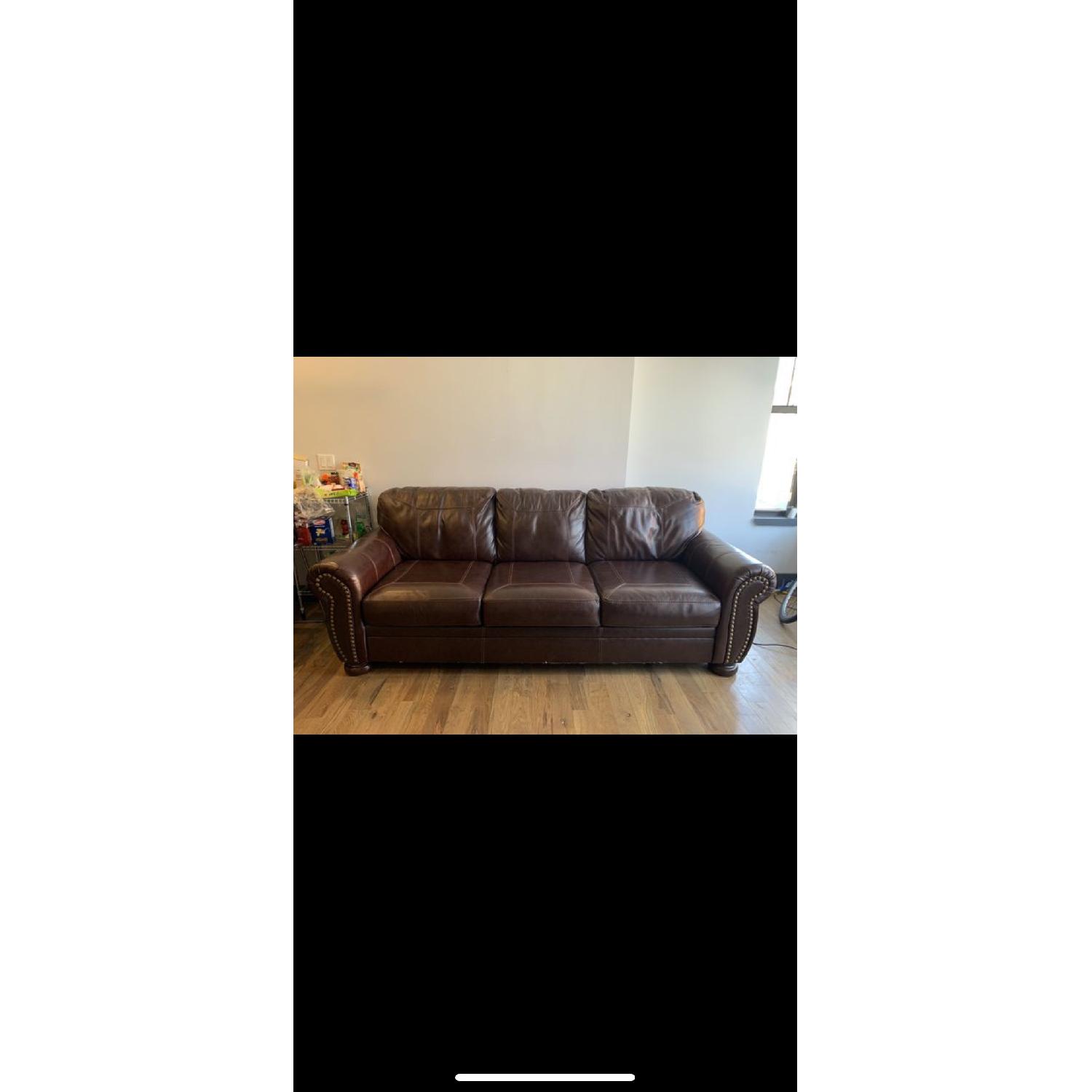 Ashley Brown Leather Sofa w/ Nailhead Trim - image-1