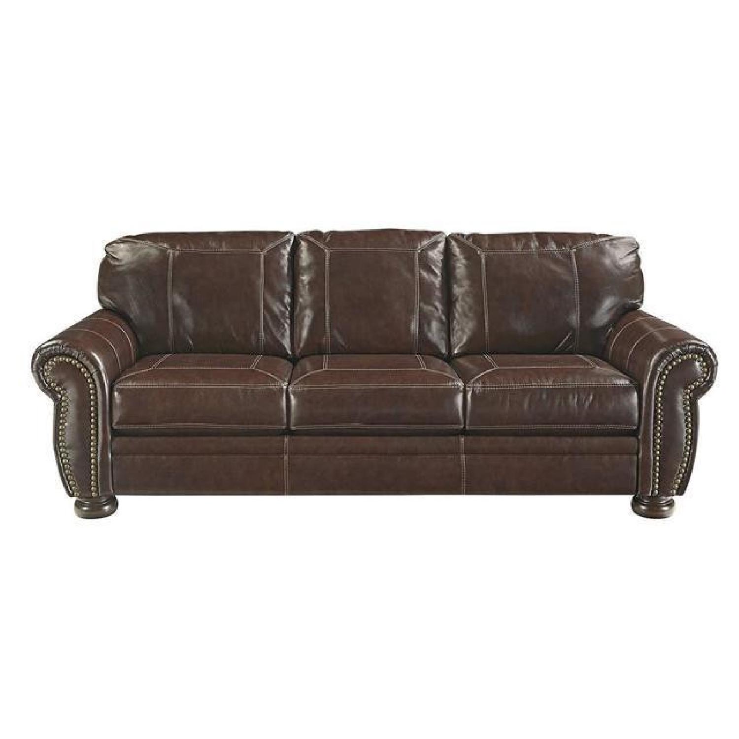 Ashley Brown Leather Sofa w/ Nailhead Trim - image-0