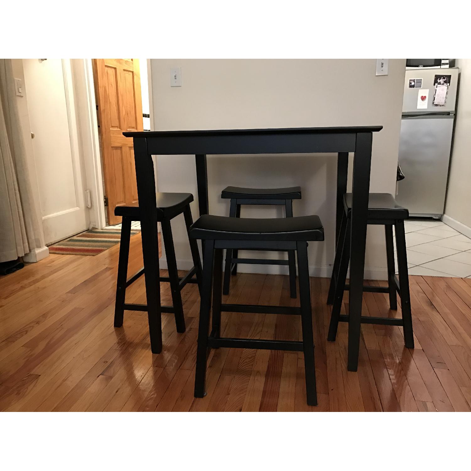 Ashley's Black Kitchen Table w/ 4 Stools AptDeco