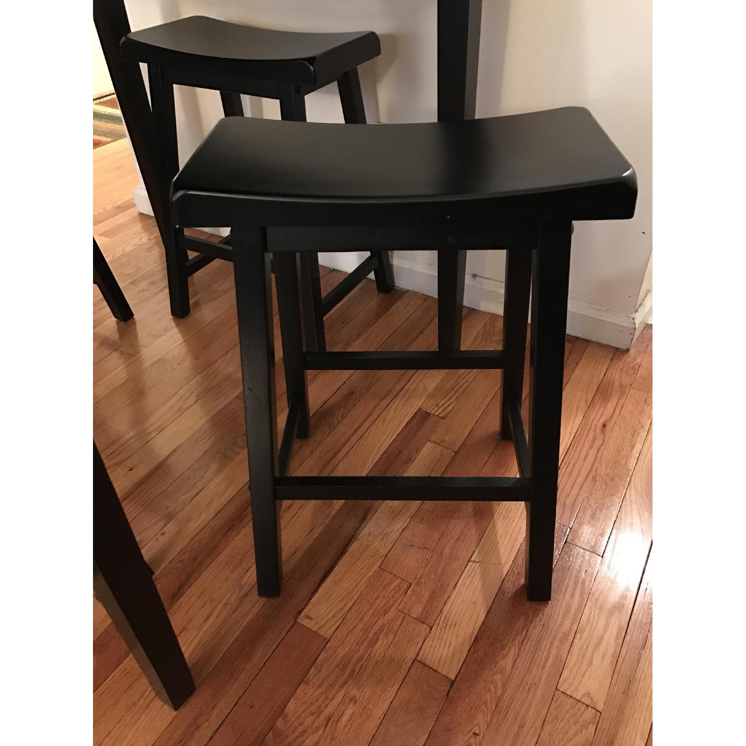 Ashley's Black Kitchen Table w/ 4 Stools AptDeco