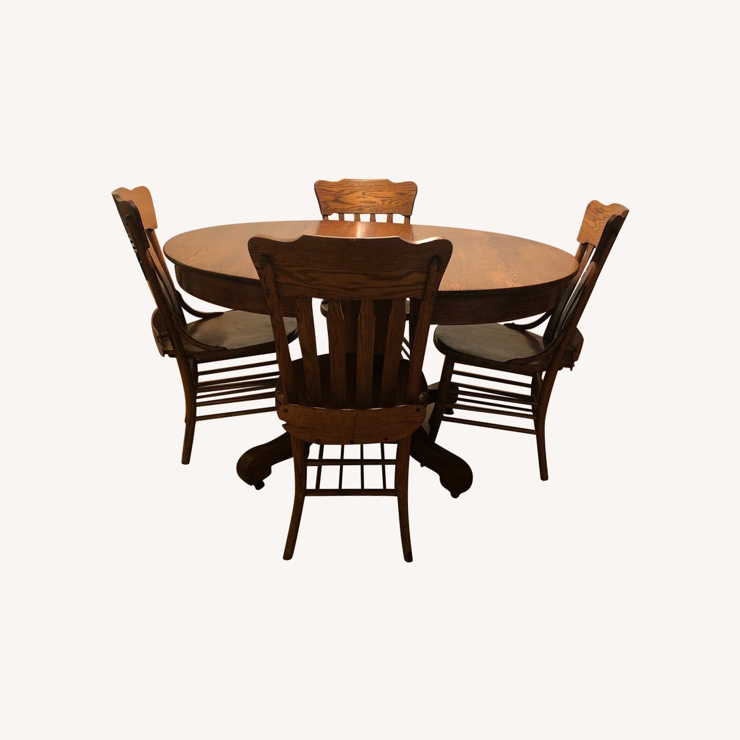 Antique Expandable Dining Table w/ 7 Matching Chairs - AptDeco