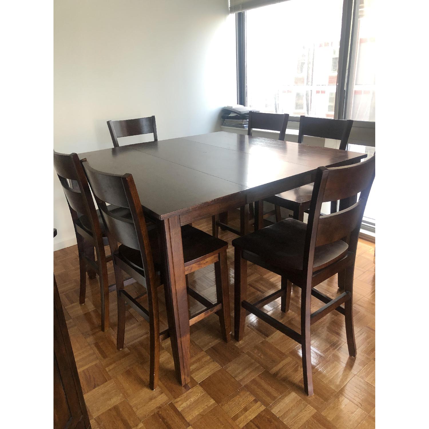 Dark brown dining table w/ 6 chairs & an extension piece. - image-7