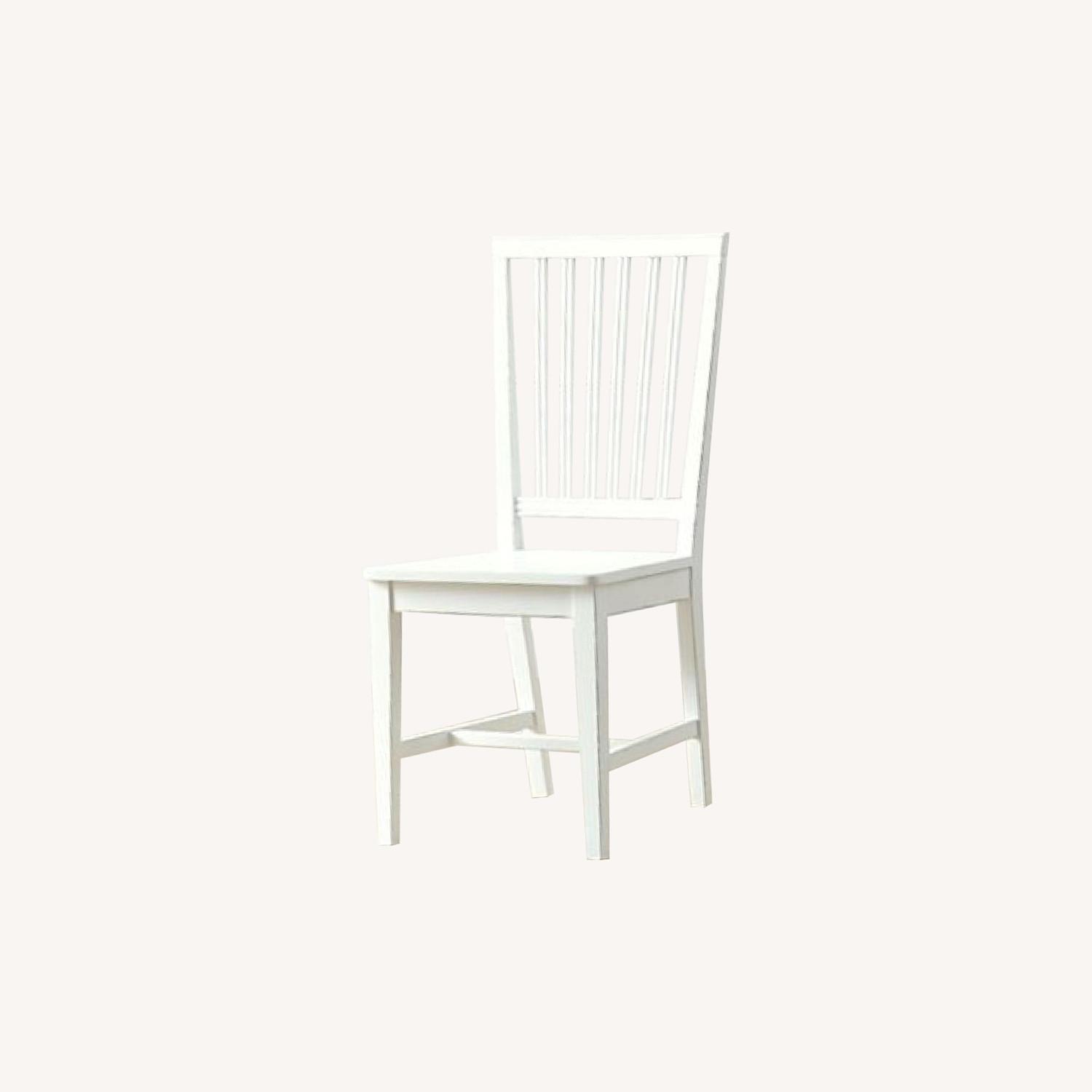 Crate and Barrel Village White Dining Chairs AptDeco