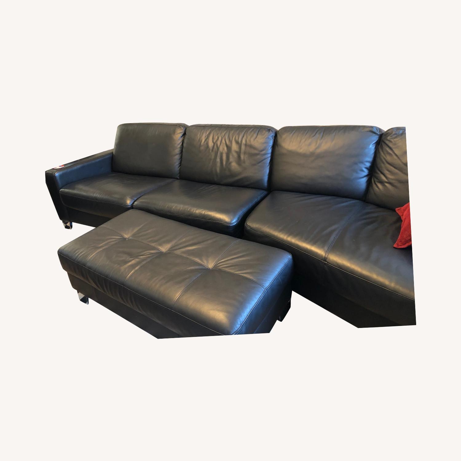 Natuzzi black leather sectional AptDeco