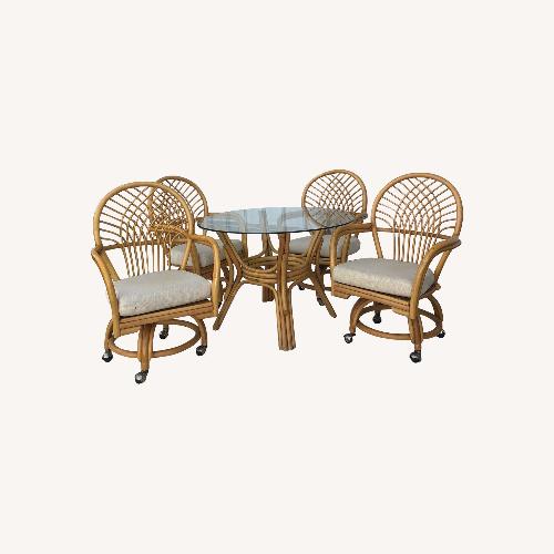 Used Rattan Dinette Set Glass Top Table & Four Chairs for sale on AptDeco