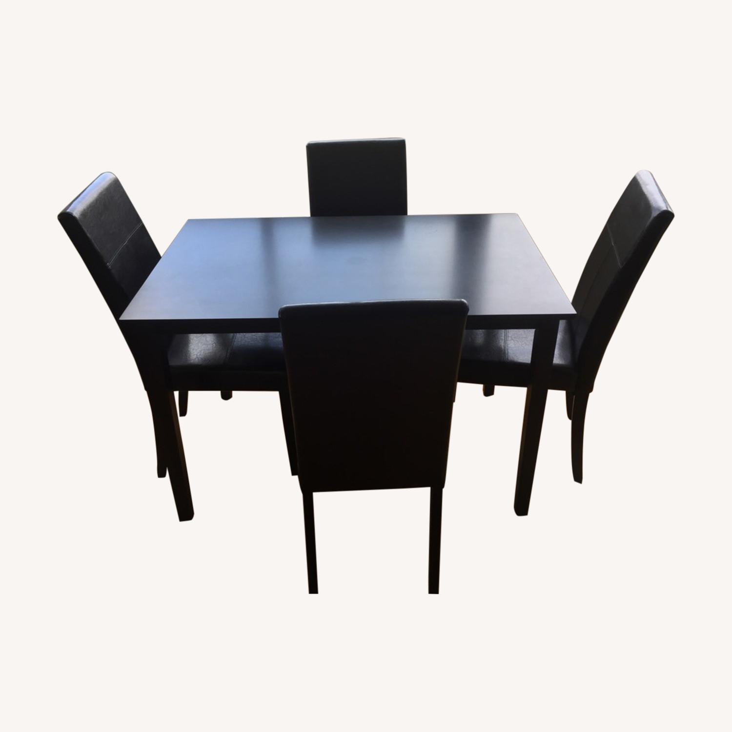 Black Table and Four Faux Leather Chairs - image-0