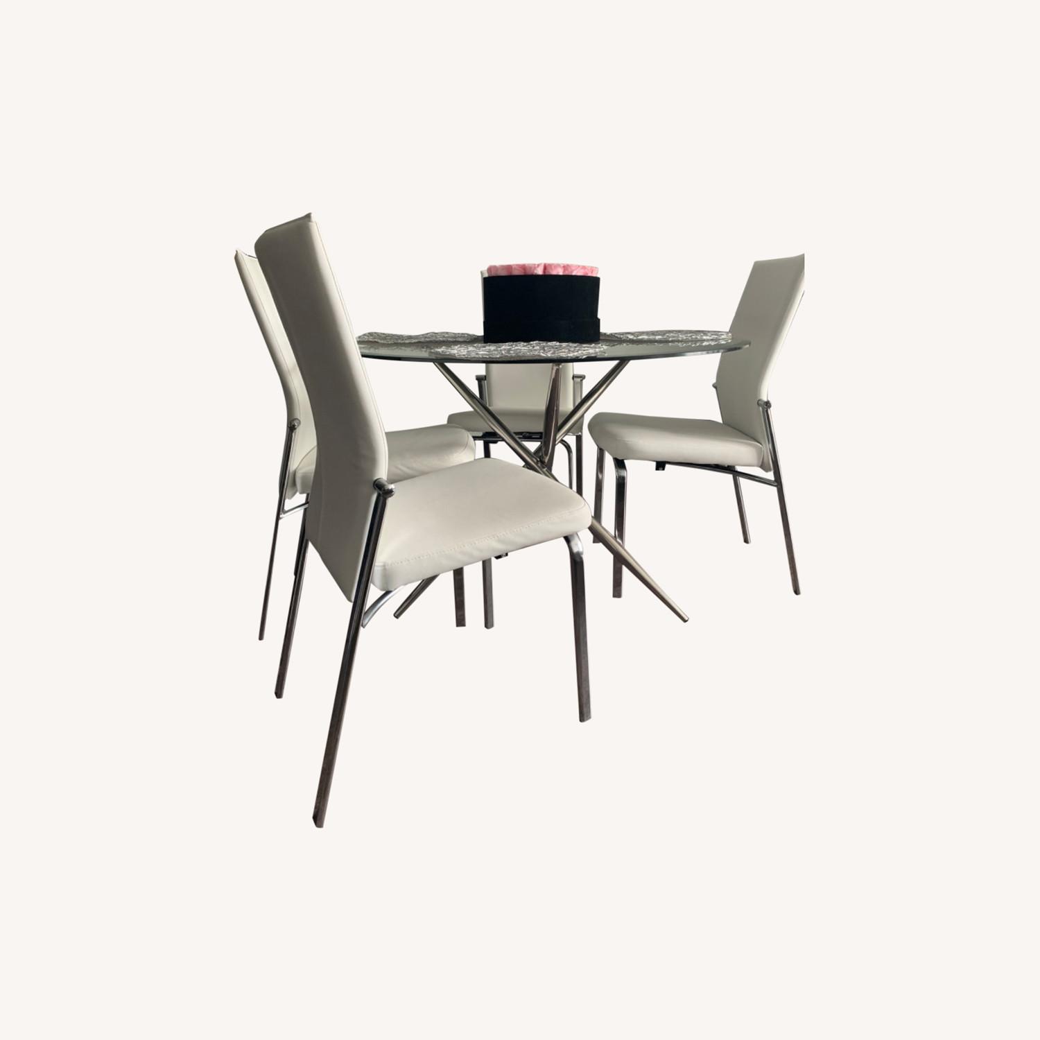 Raymour & Flanigan Glass Table with Four Chairs AptDeco