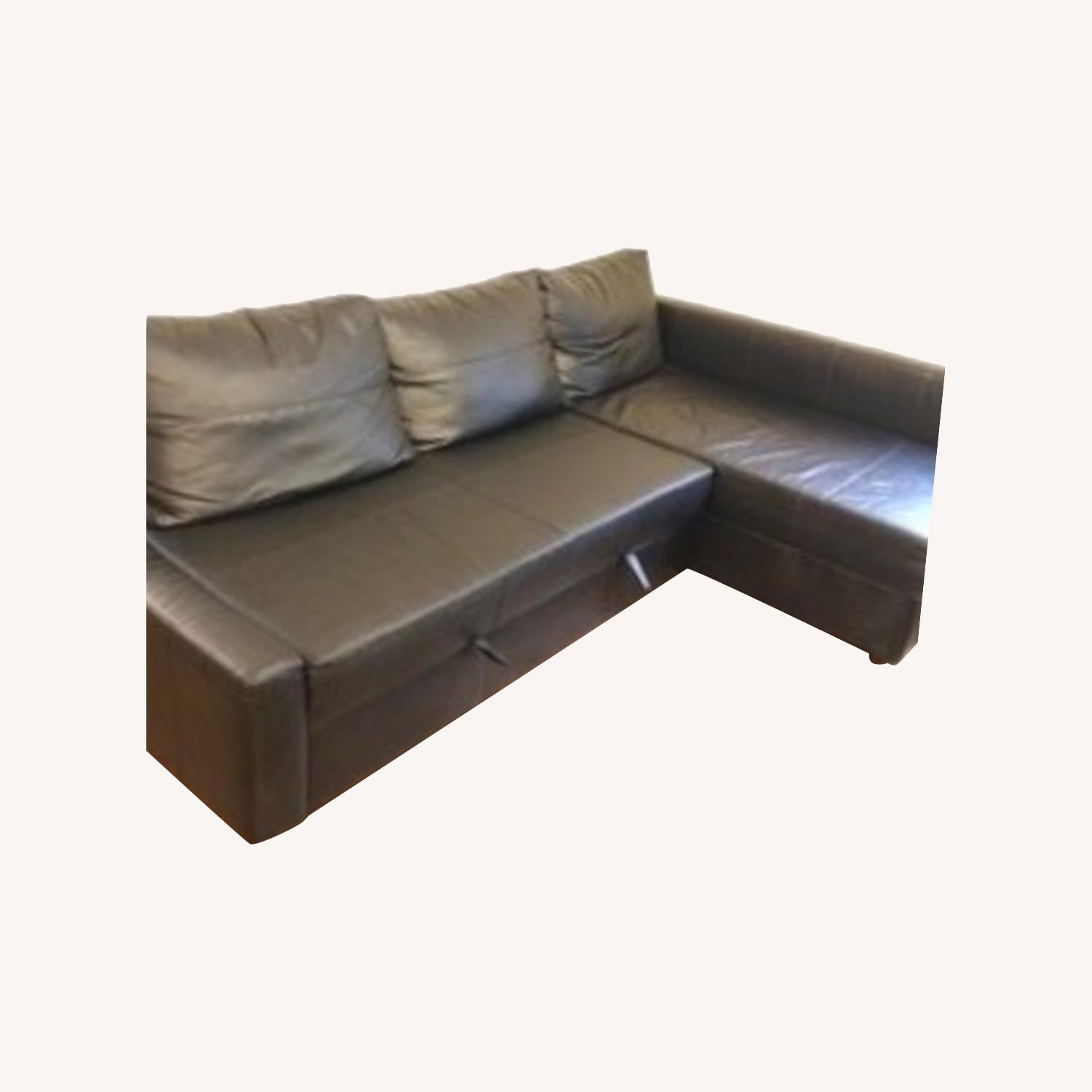 IKEA Black Faux Leather Pull Out Couch AptDeco