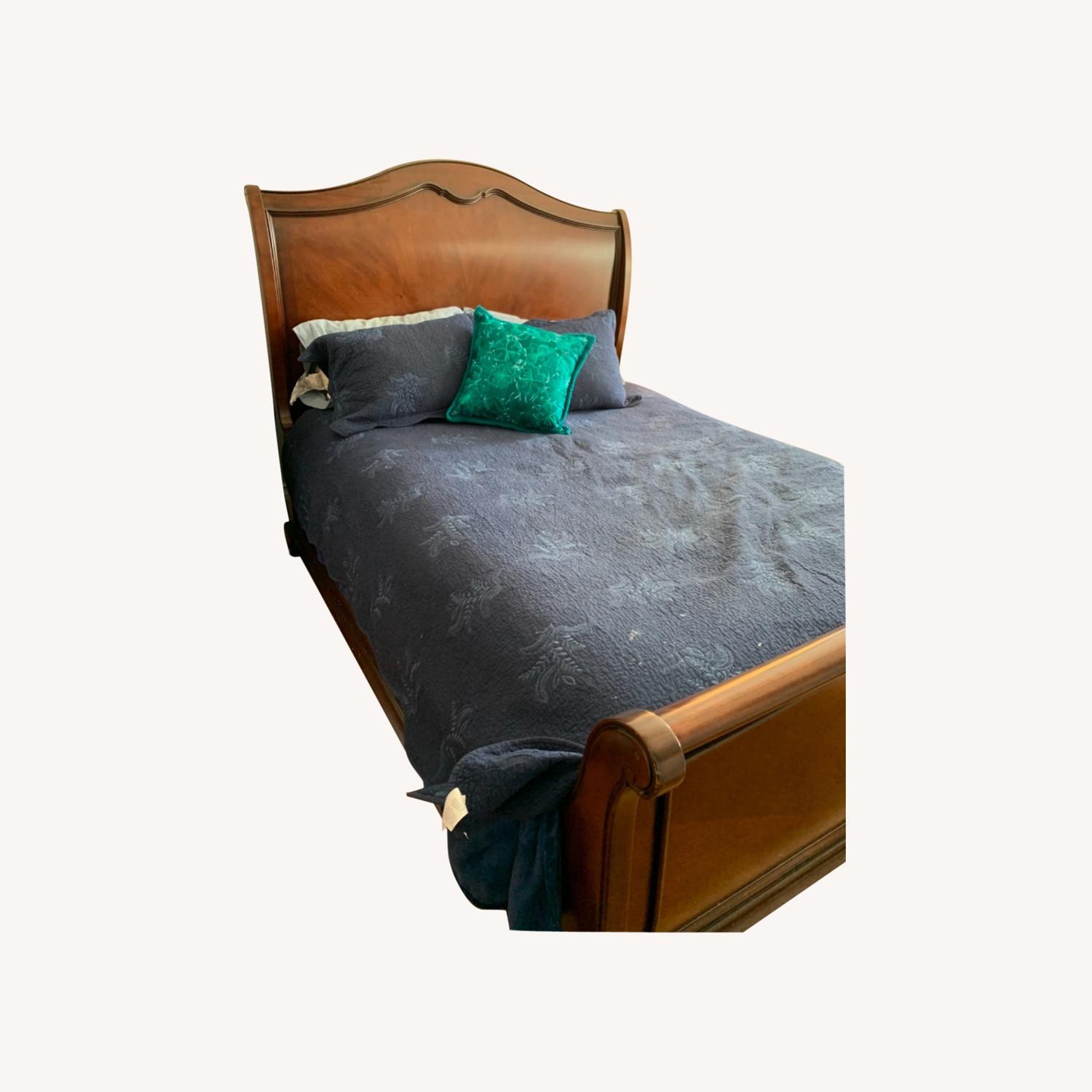 Raymour & Flanigan Dark Wood Queen Sleigh Bed AptDeco