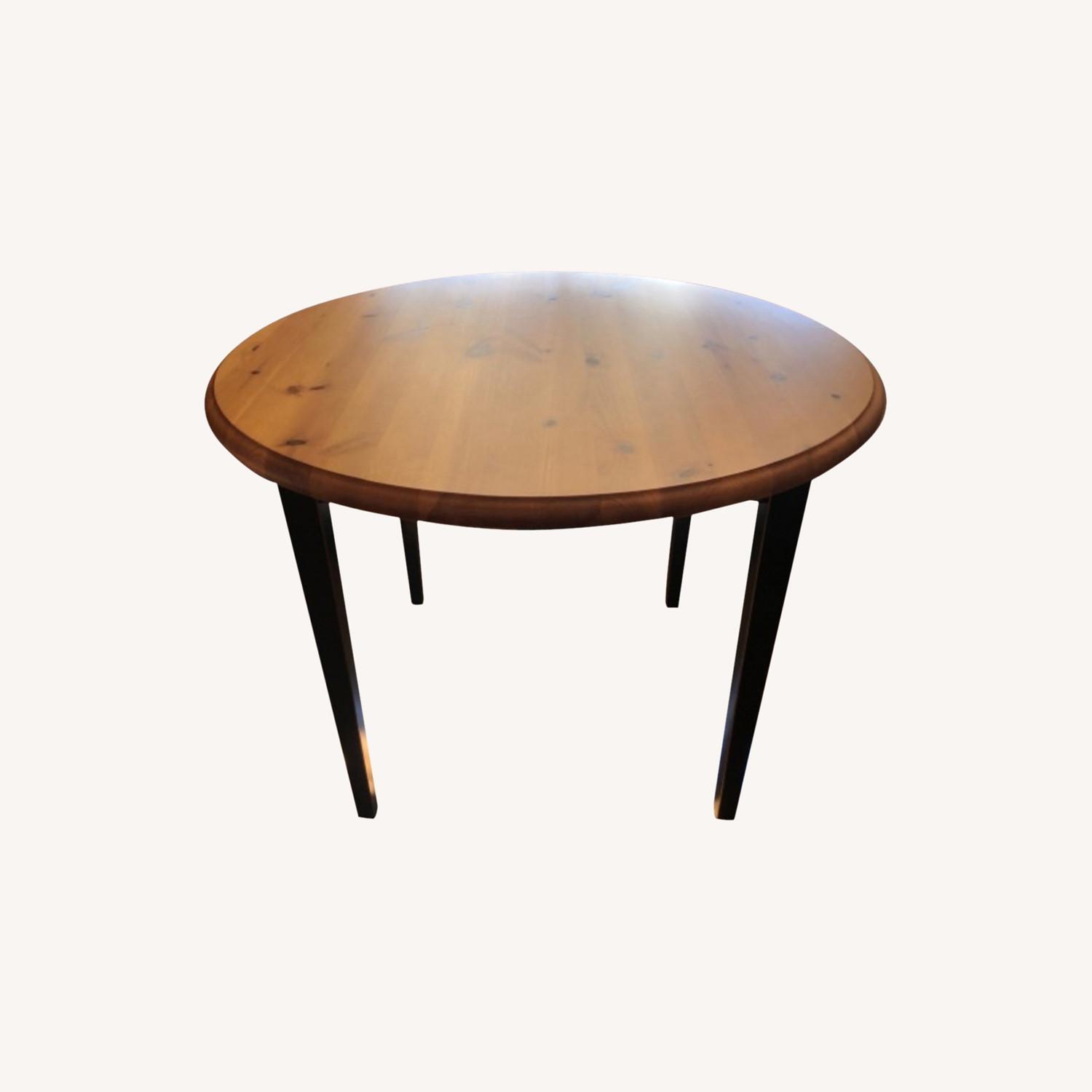 Pier 1 Dining Table with Teal Leg Accent AptDeco